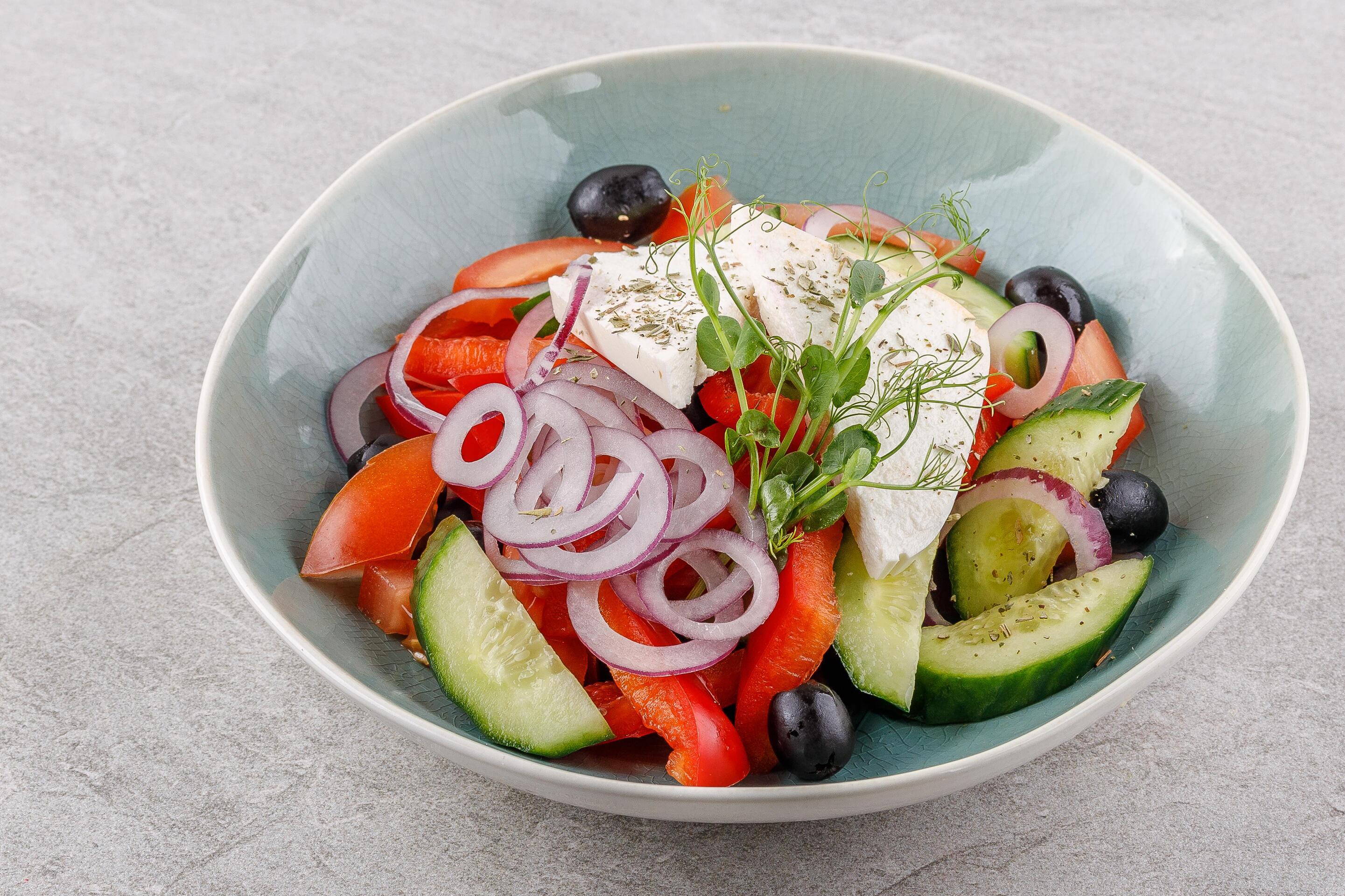 Greek salad on a stone background studio food photo 3 Stock Free