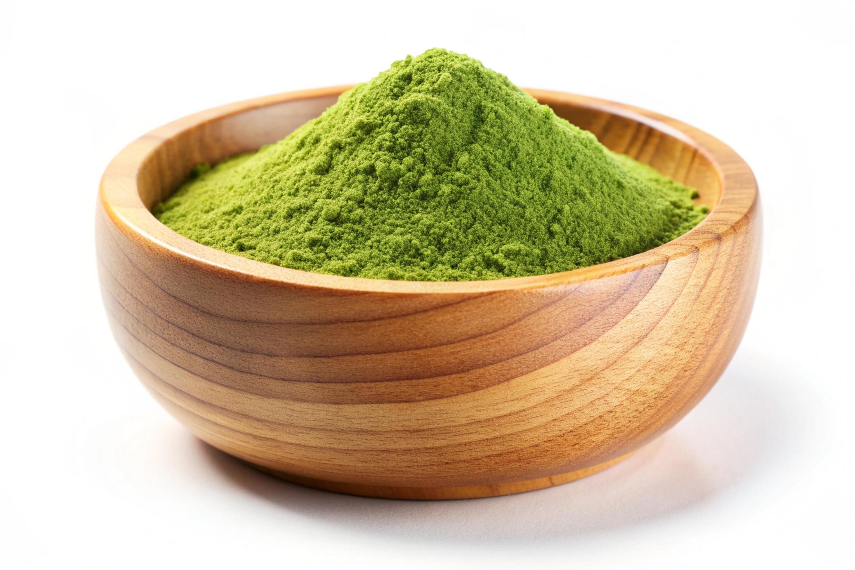 Instant green tea powder in wood bowl isolated on white background Stock Free