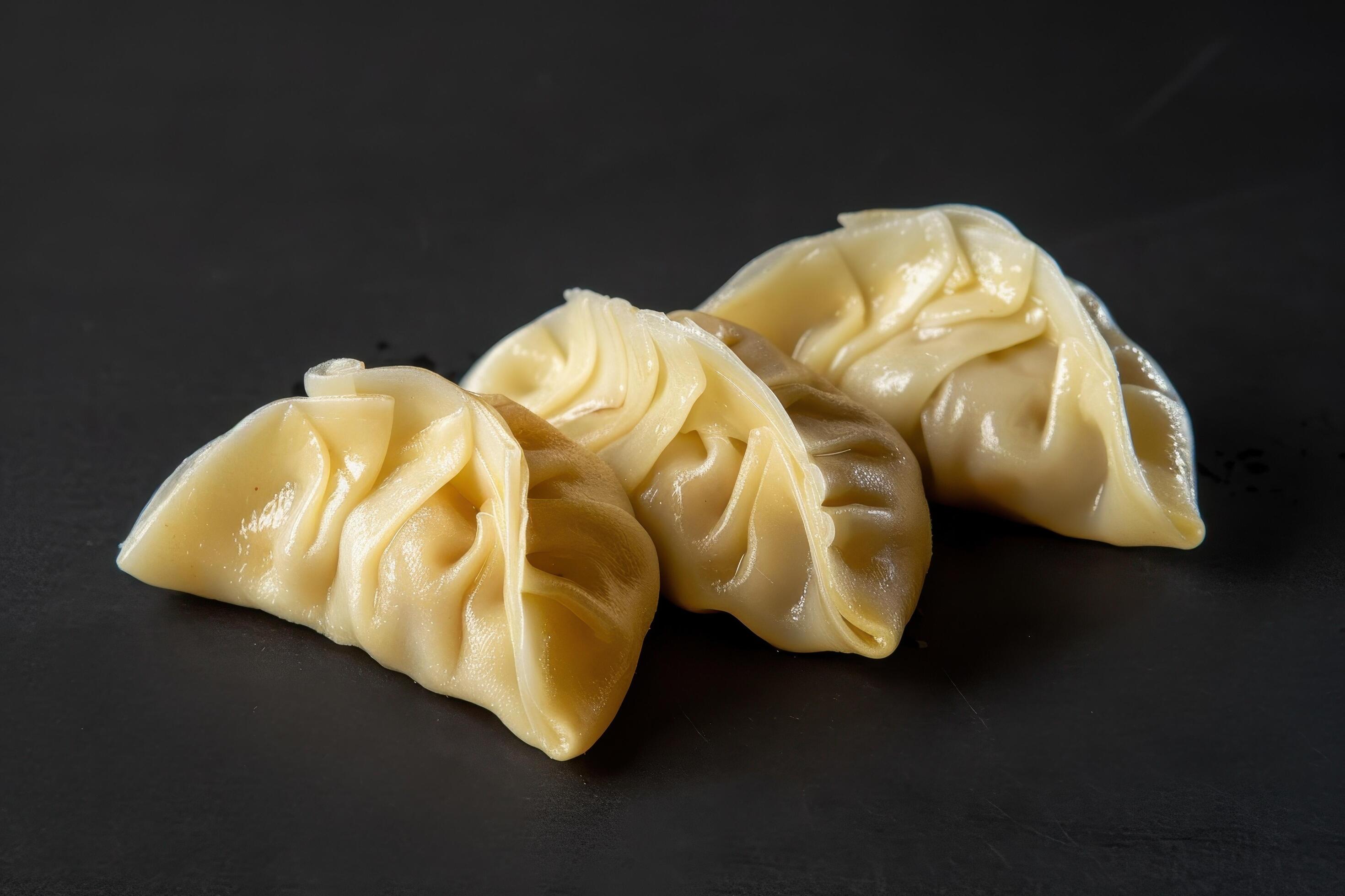 Three Steamed Dumplings on Black Background Stock Free