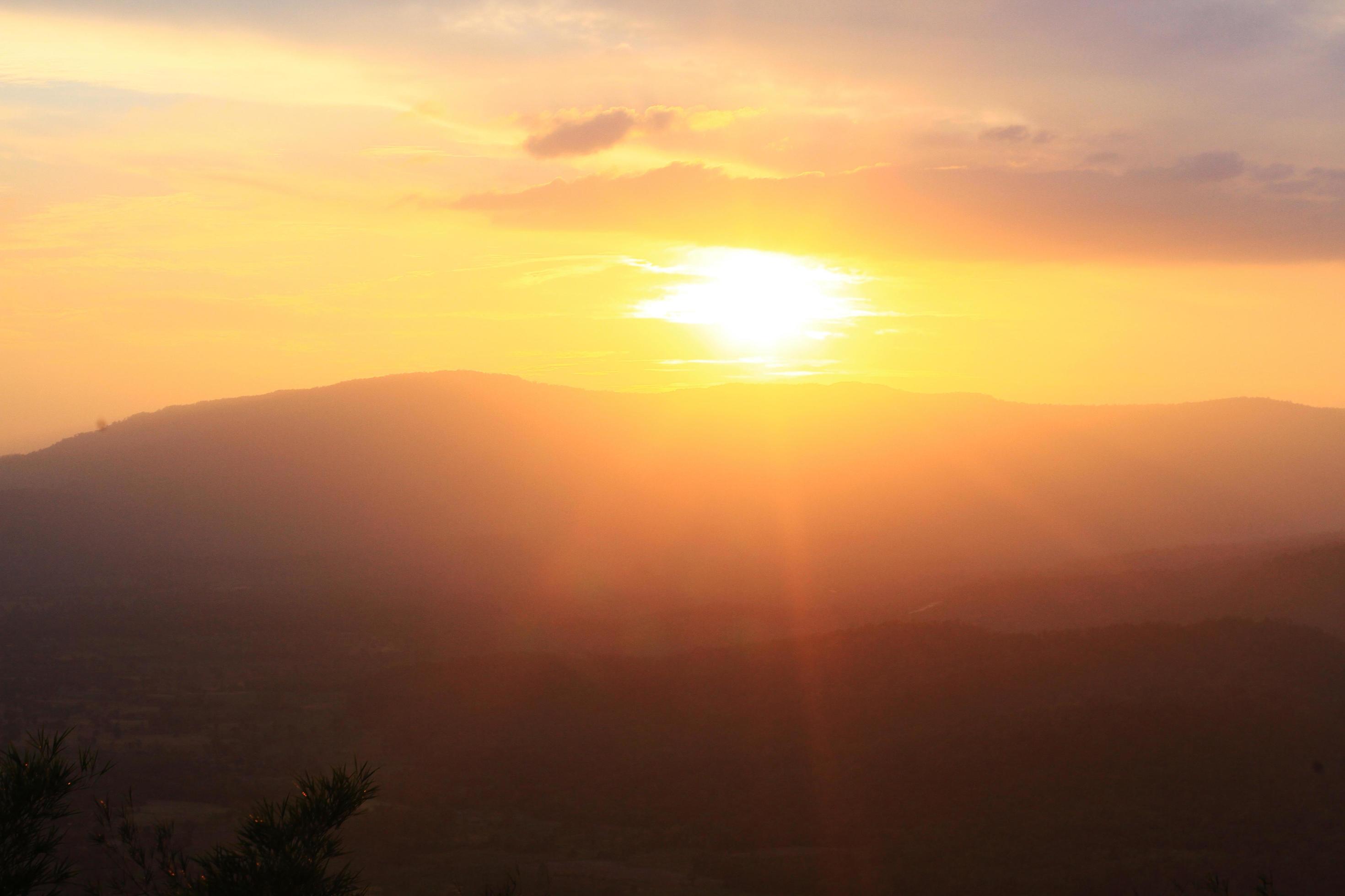 Beautiful landscape layers of mountain and Misty on hill valley in golden twilight of sunset at Thailand Stock Free