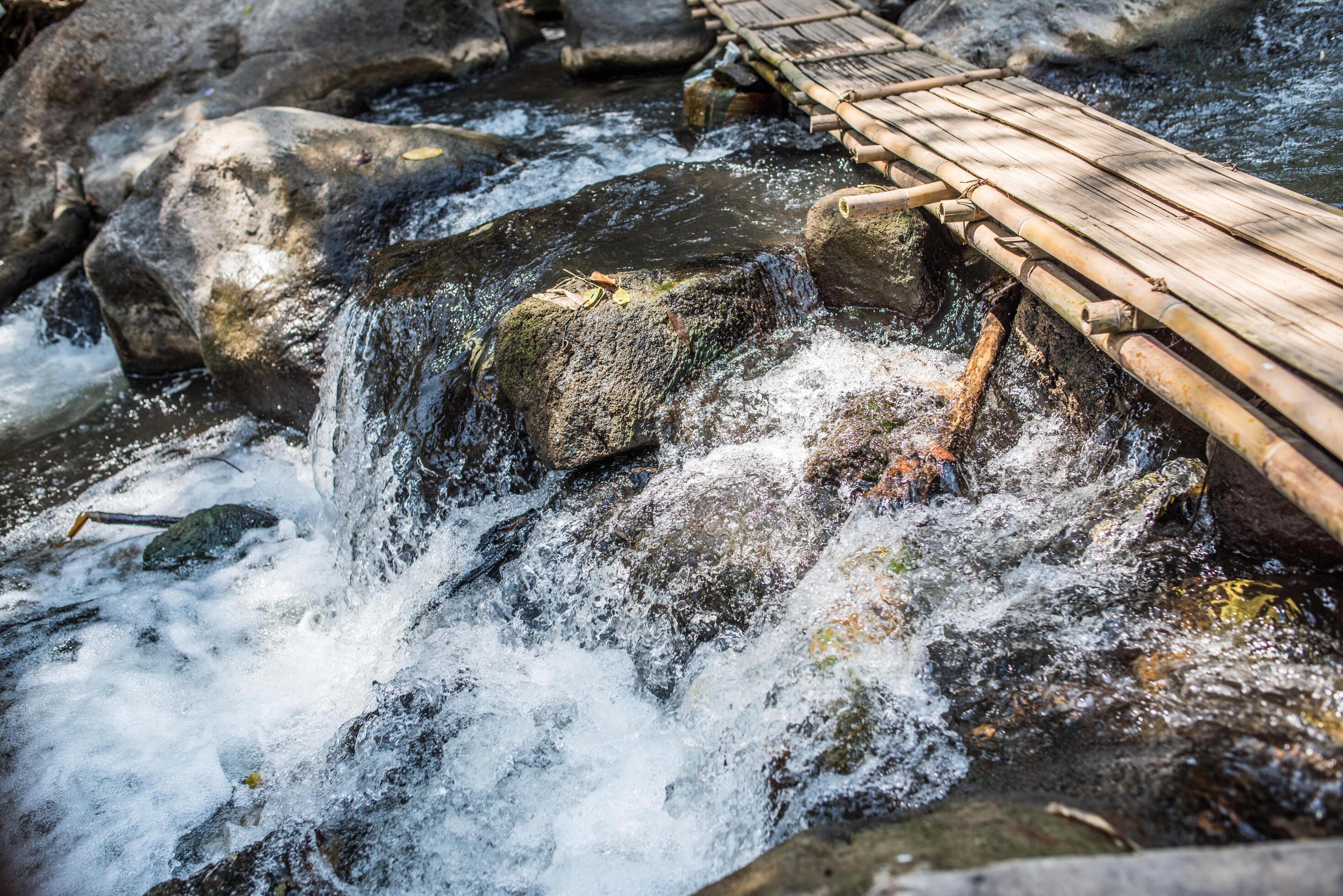 Waterfall in the nature and stone background Stock Free