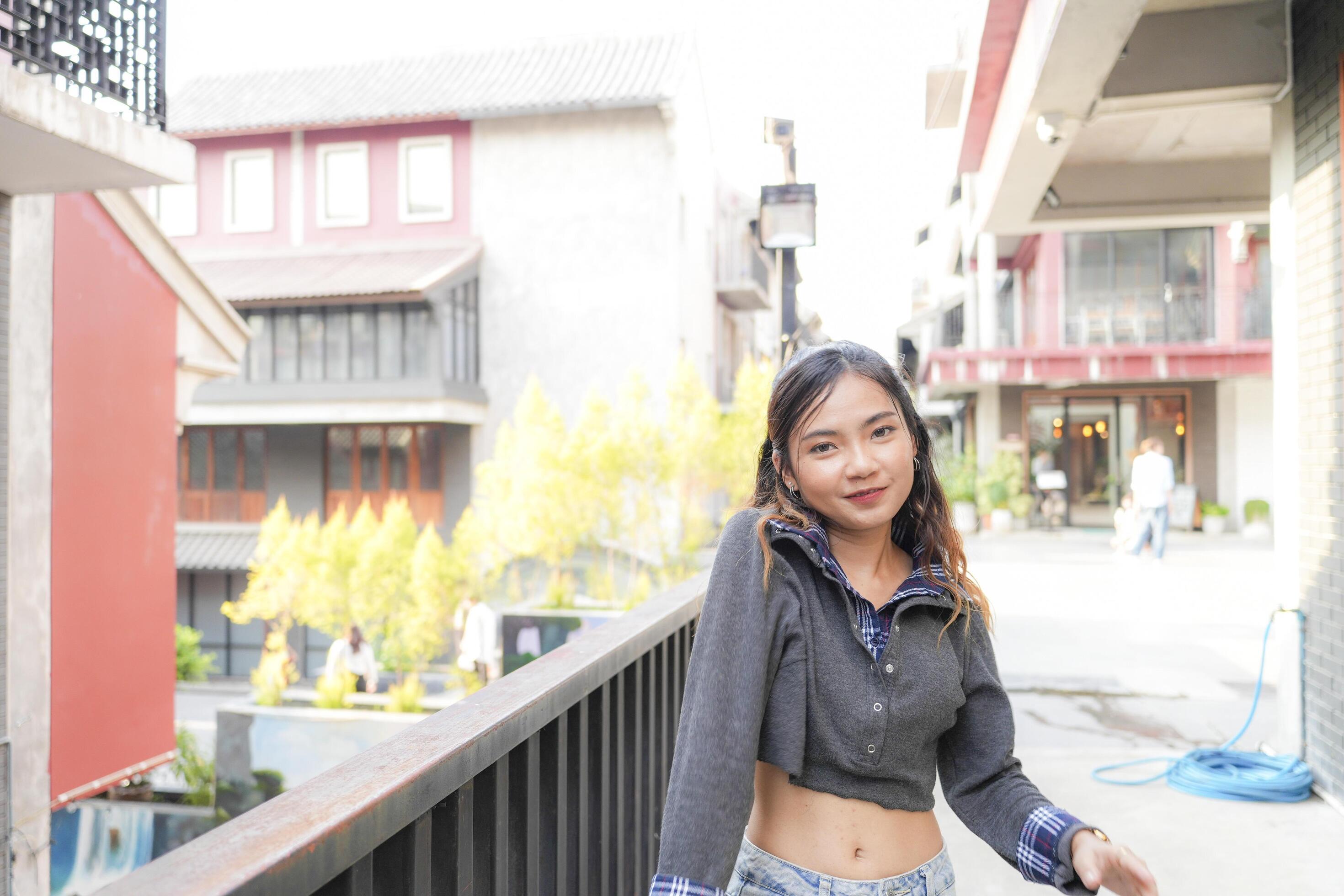 Asian women do freestyle hip hop and breakdancing in a public space in the middle of the city. With a cheerful and happy attitude Stock Free