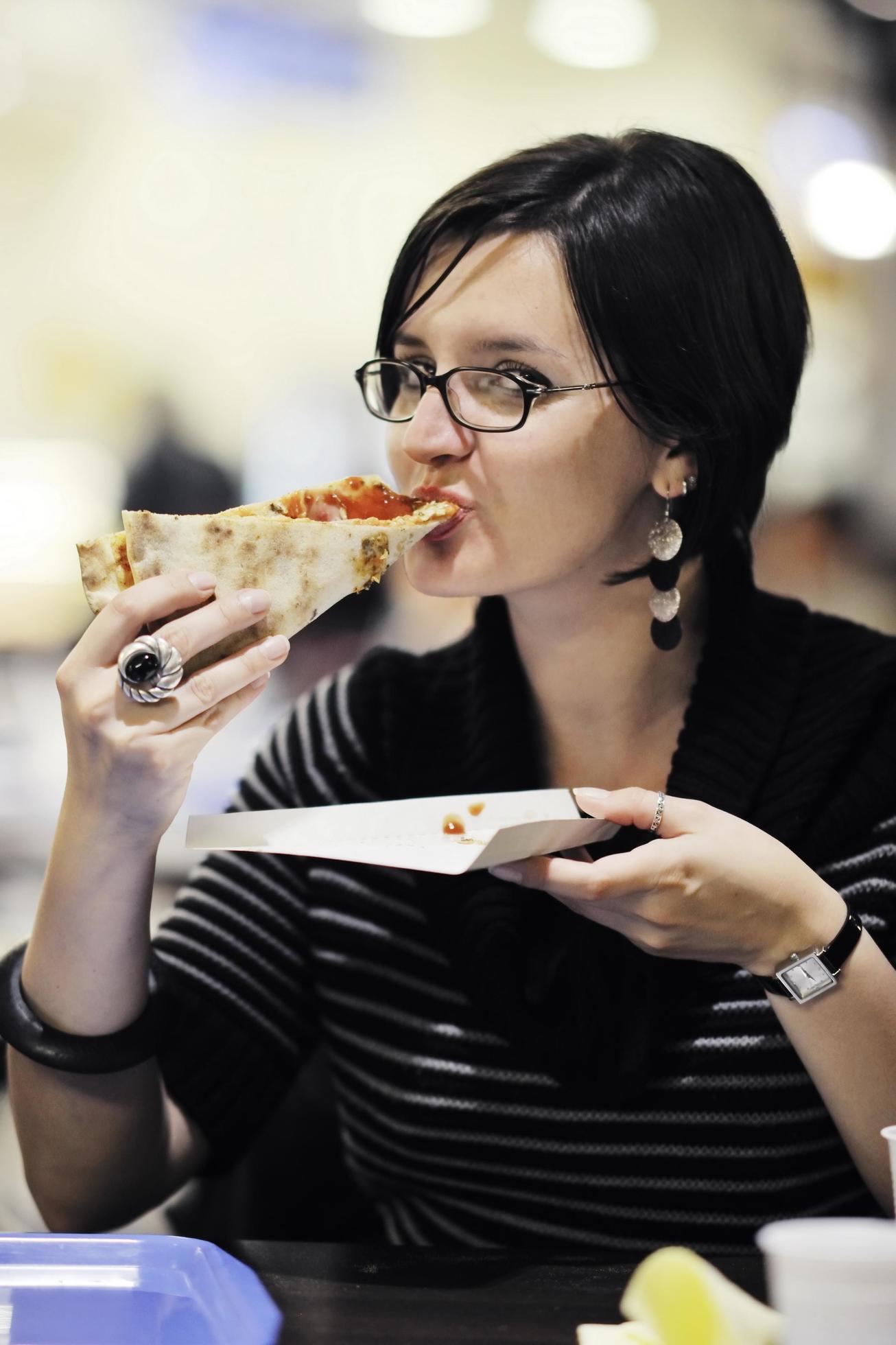 woman eat pizza food at restaurant Stock Free