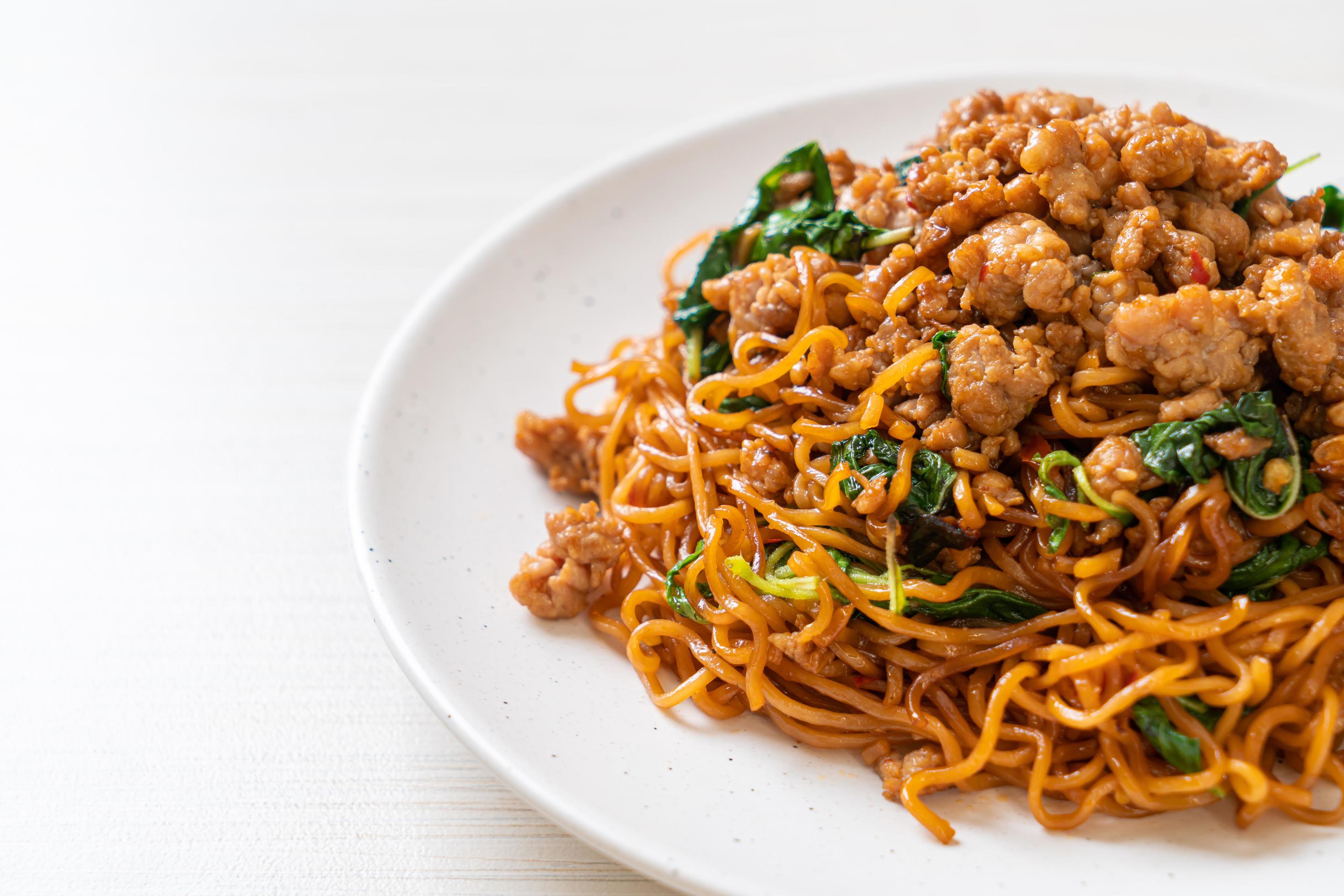 
									Stir-fried instant noodles with Thai basil and minced pork – Asian food style Stock Free