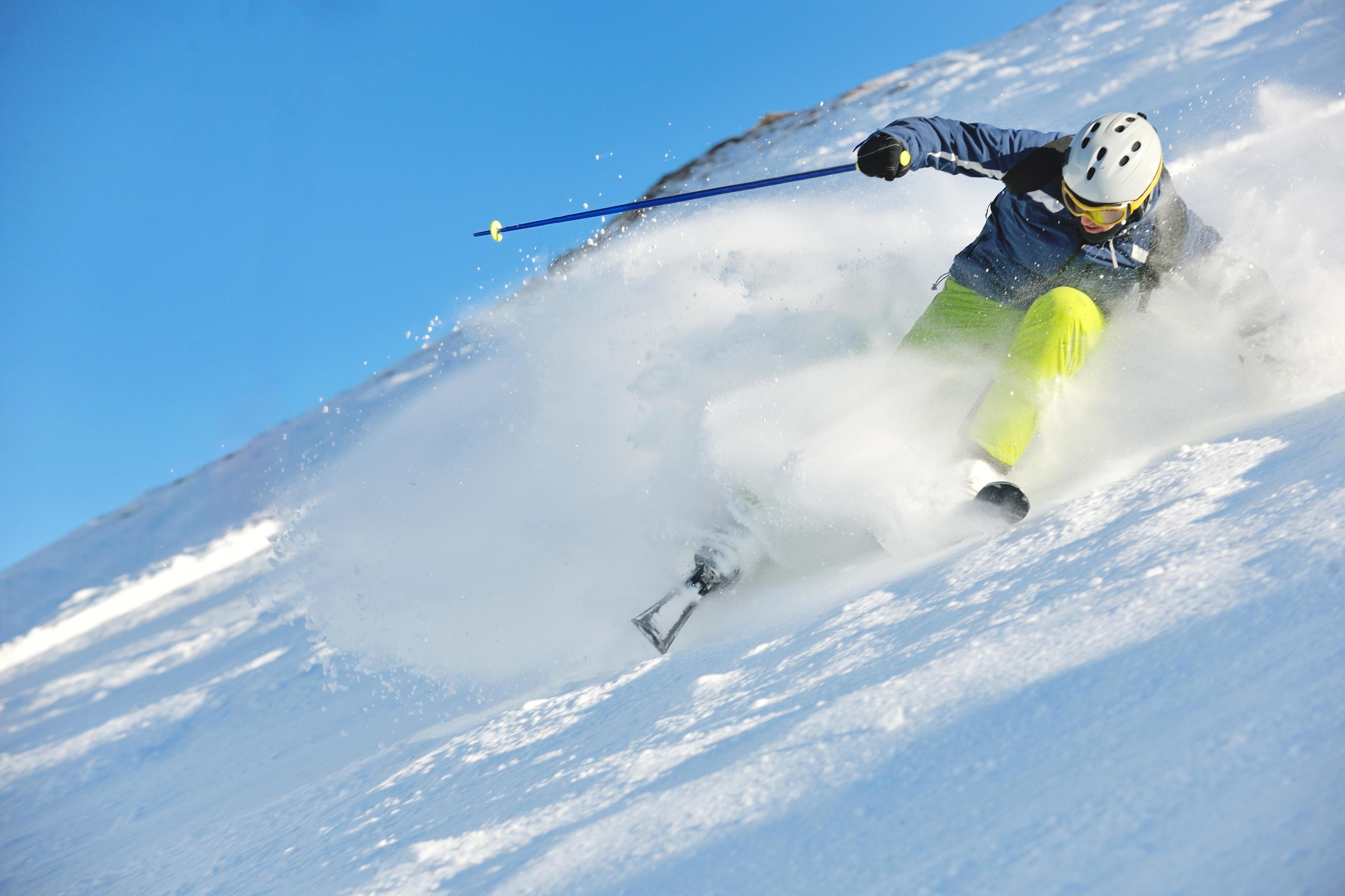 skiing on fresh snow at winter season at beautiful sunny day Stock Free