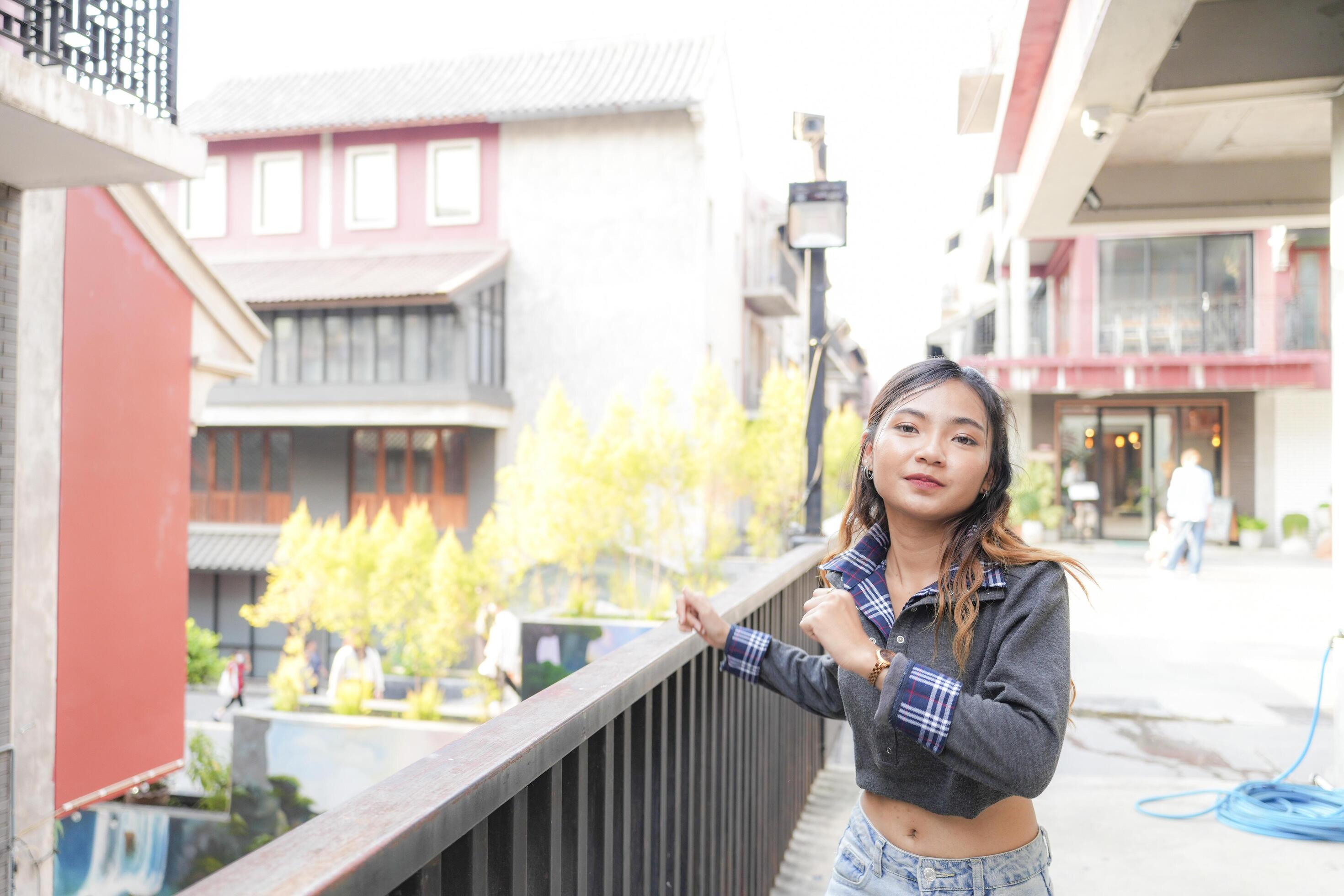 Asian women do freestyle hip hop and breakdancing in a public space in the middle of the city. With a cheerful and happy attitude Stock Free