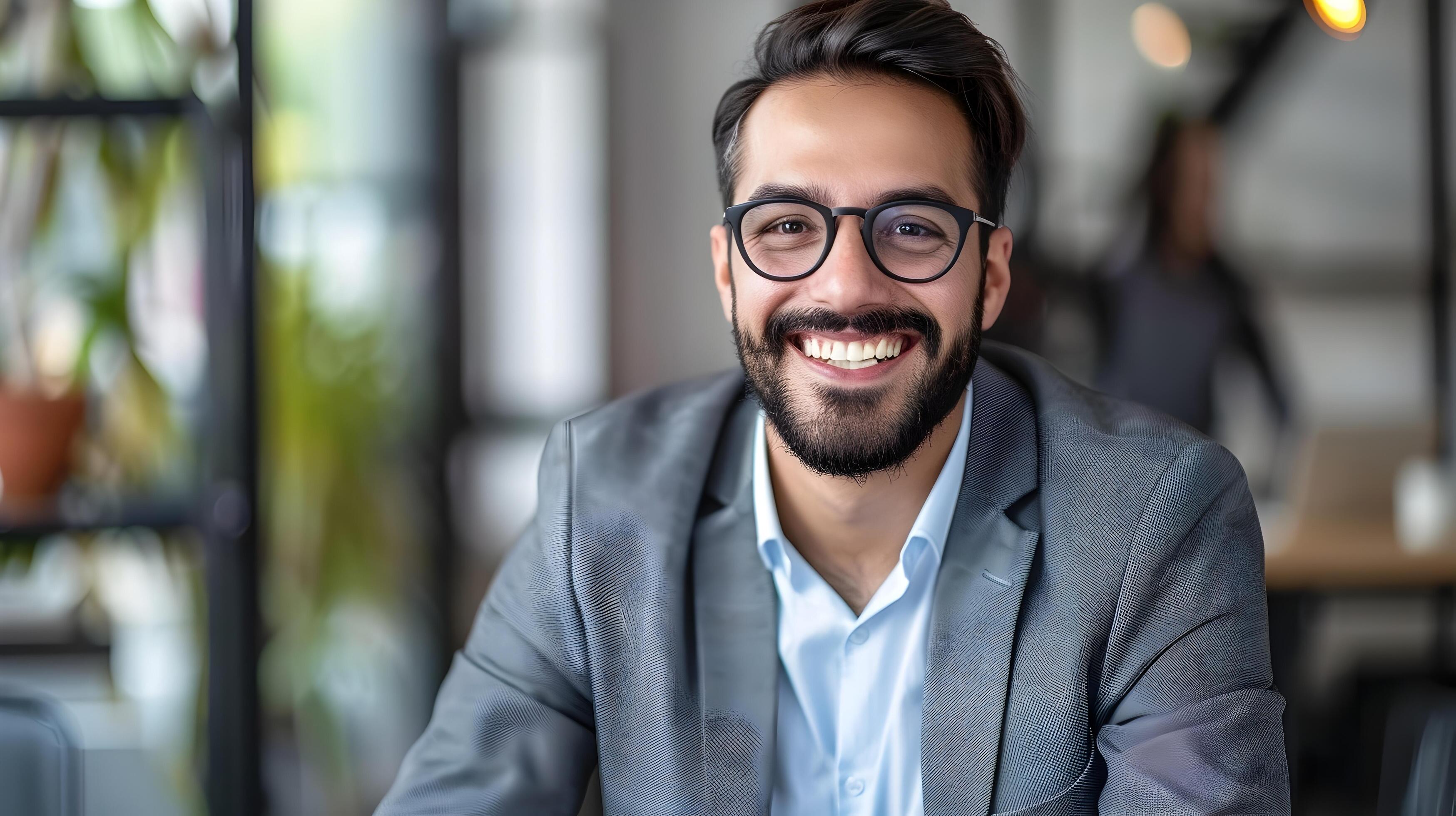 Confident Professional Businessman Smiling in Office Environment Stock Free