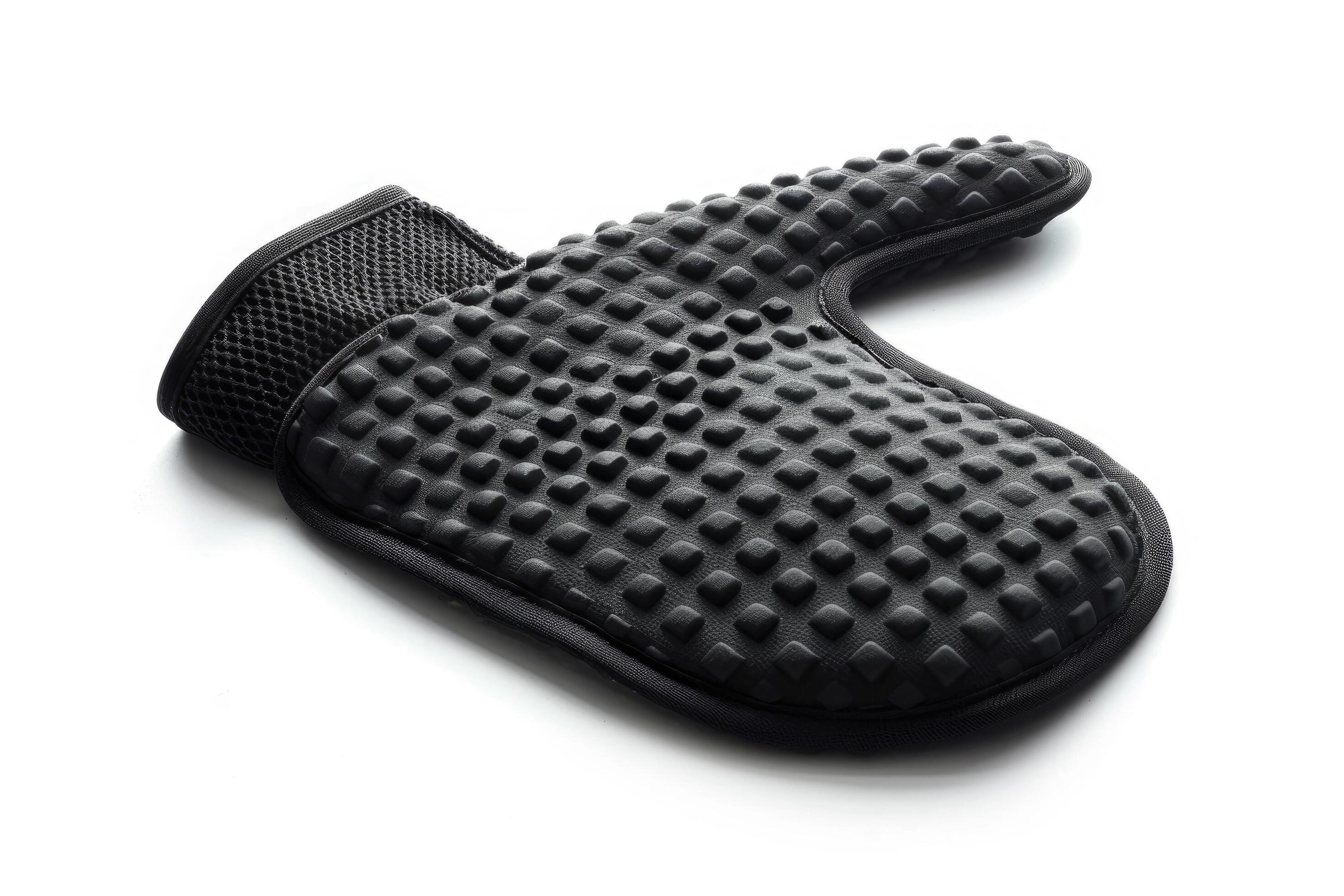 Black silicone oven mitt on a white background. Stock Free