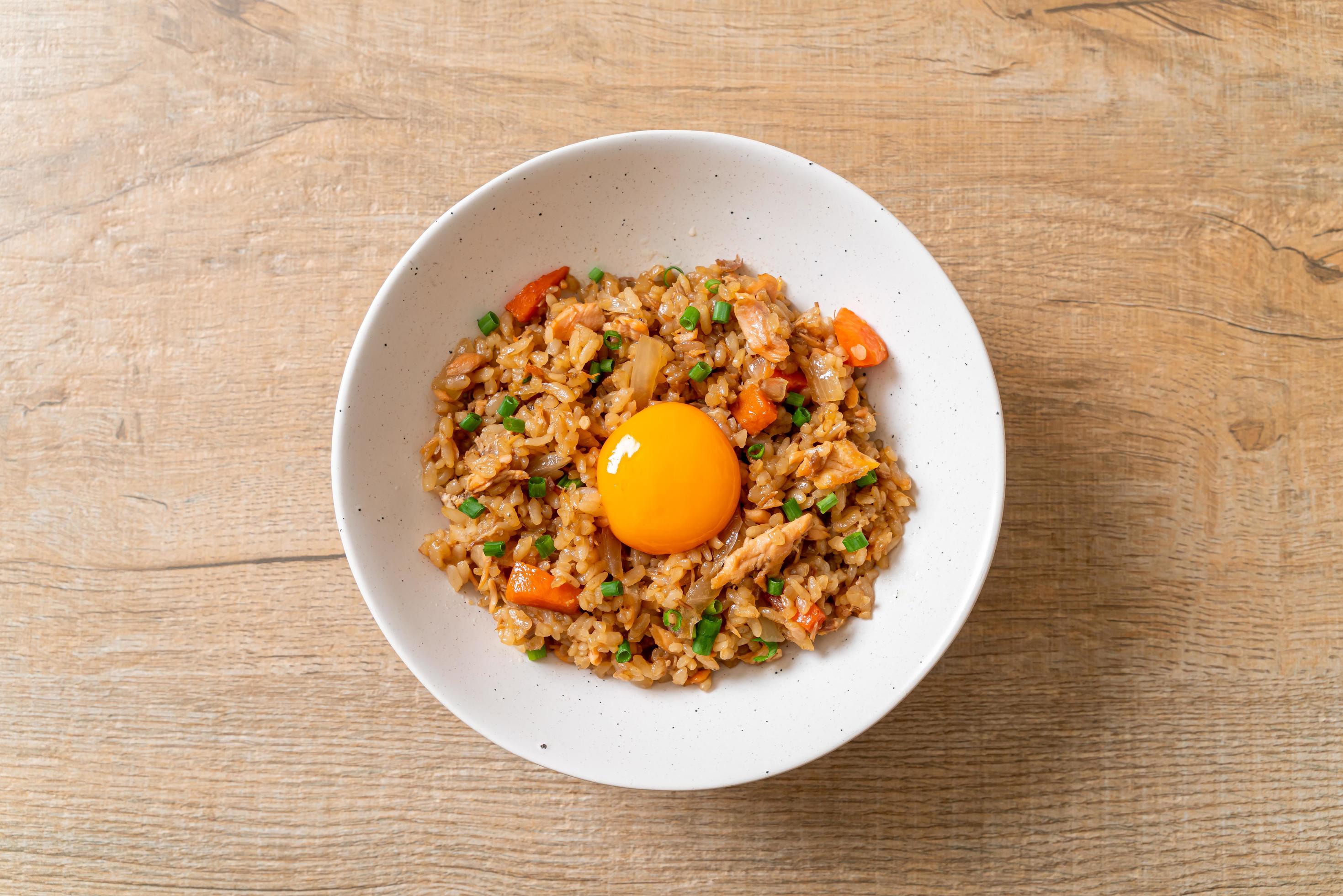 Salmon fried rice with pickled egg on top – Asian food style Stock Free