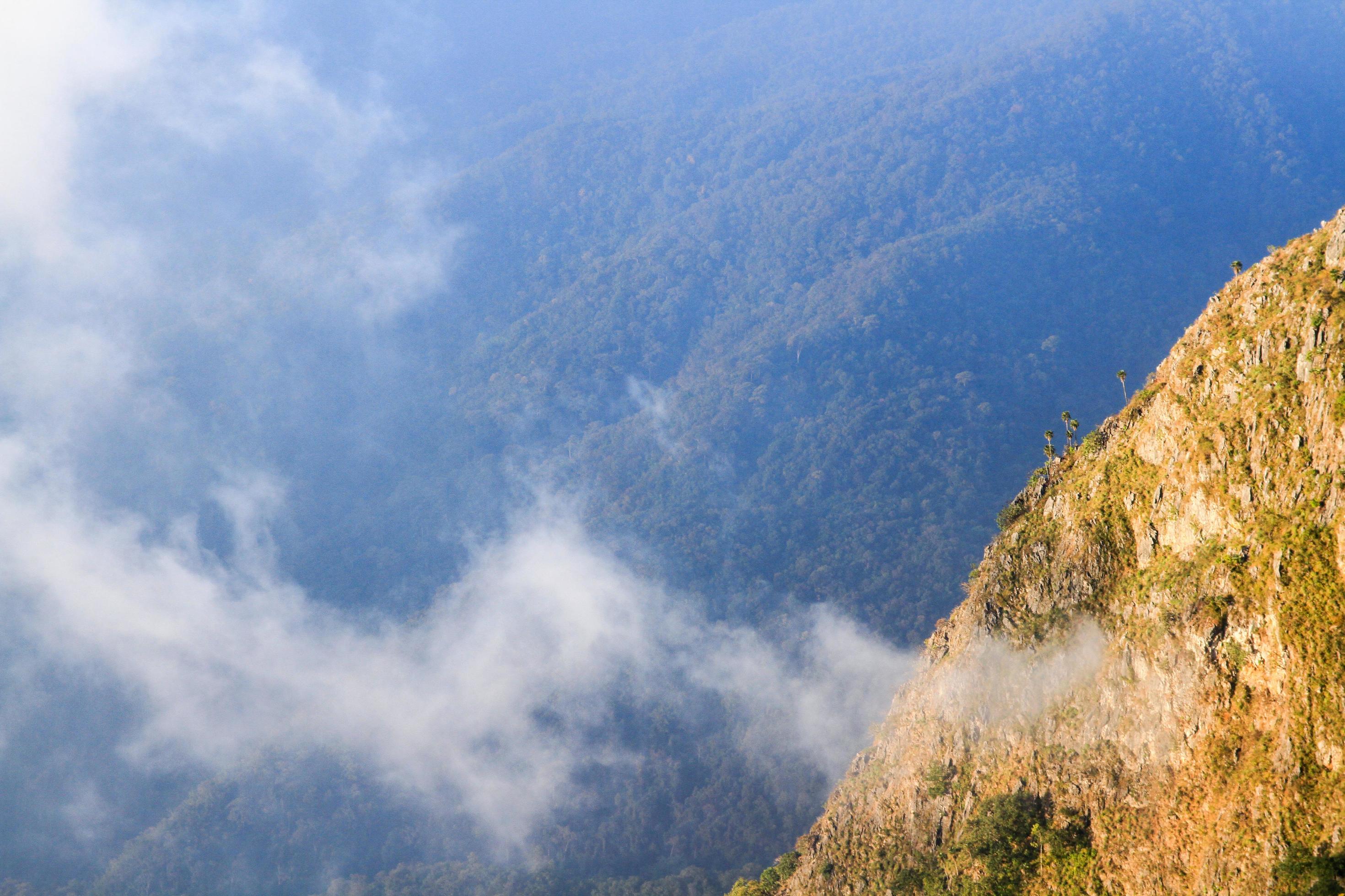 Sunrise in morning with sky and cloud on the Limestone mountain. Sunray with Fog and mist cover the jungle hill in Thailand Stock Free