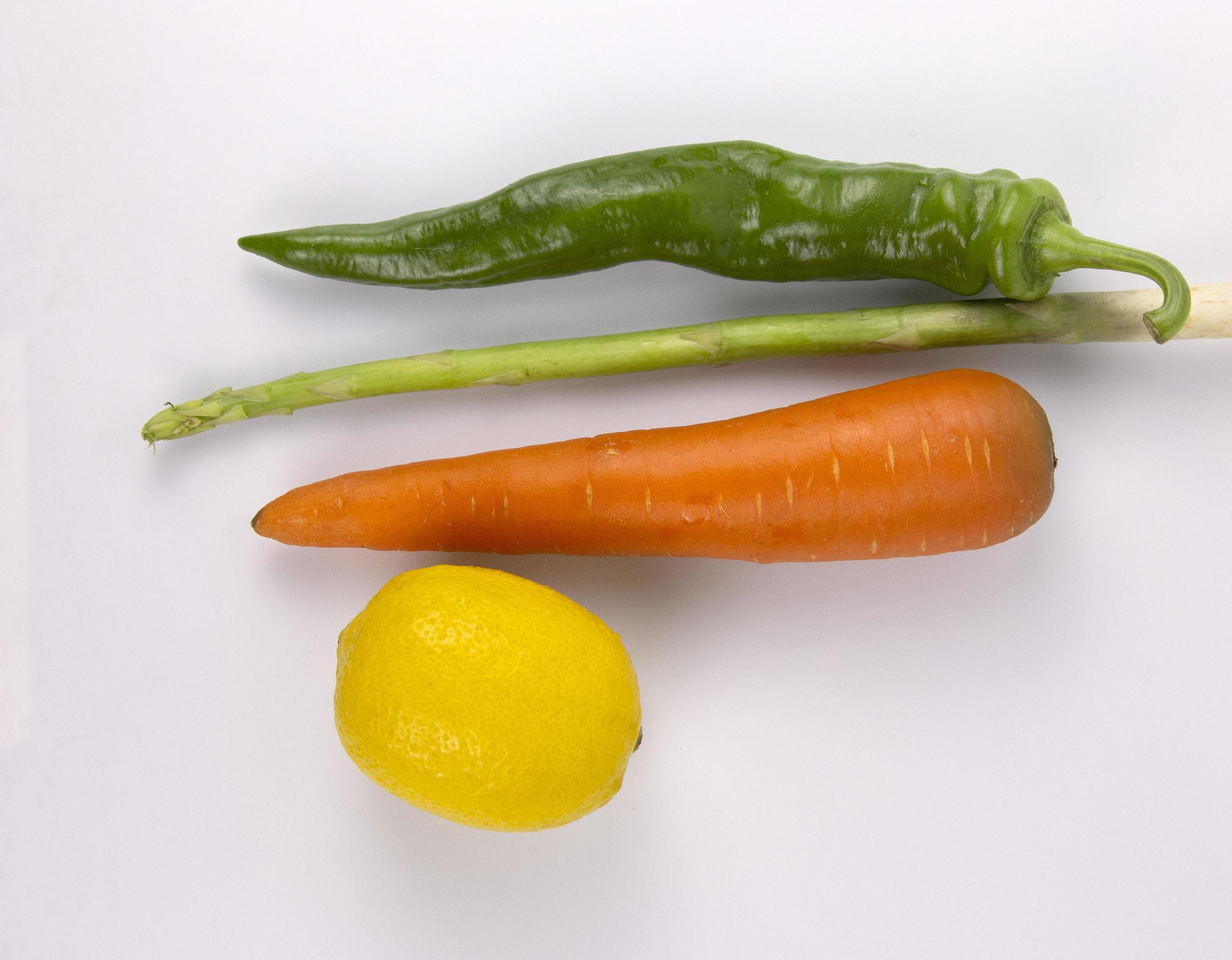 Healthy food for cooking, carrot, chili, lemon, Asparagus isolated on white background Stock Free