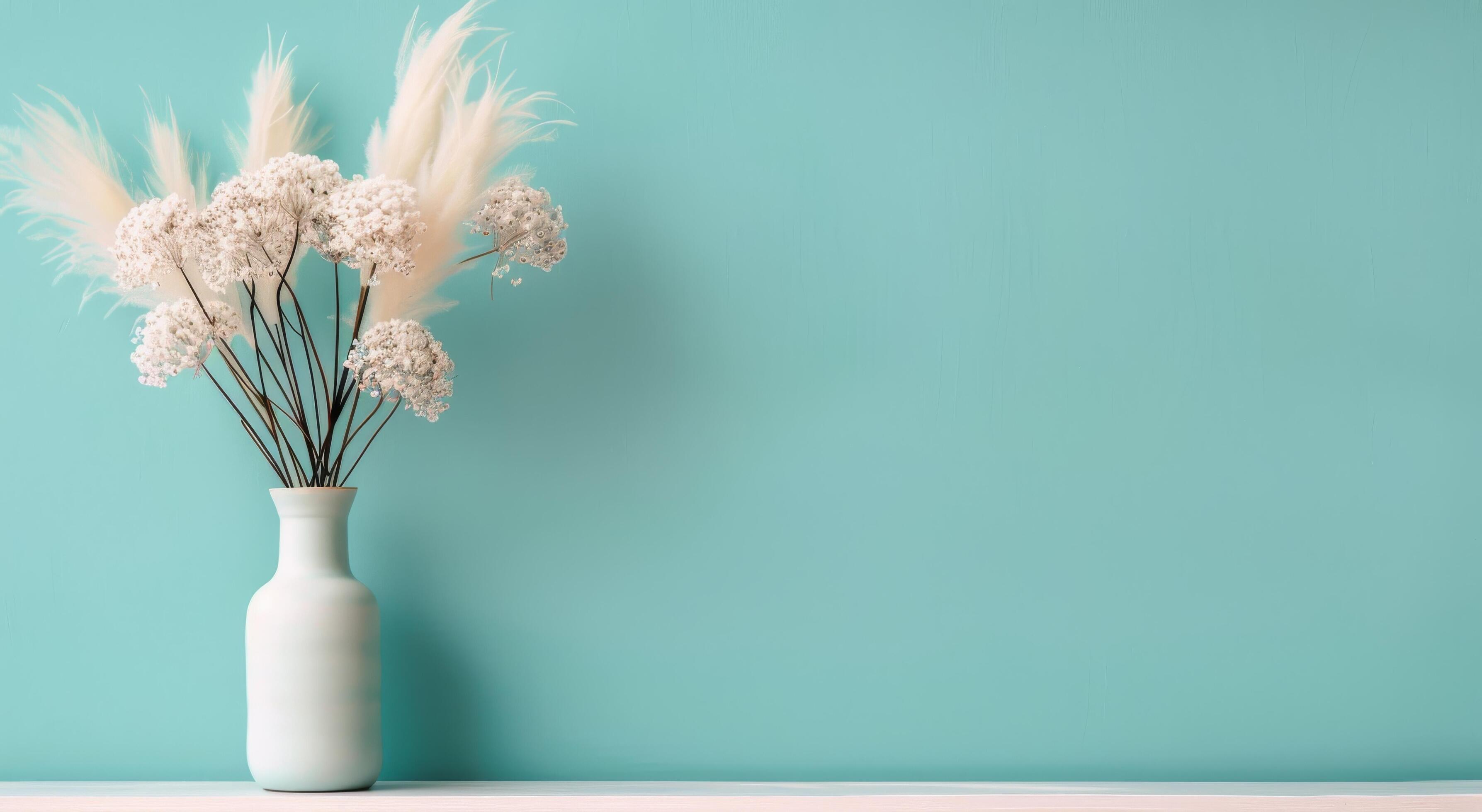 Elegant White Flowers in a Simple Vase Against a Soft Blue Background Stock Free