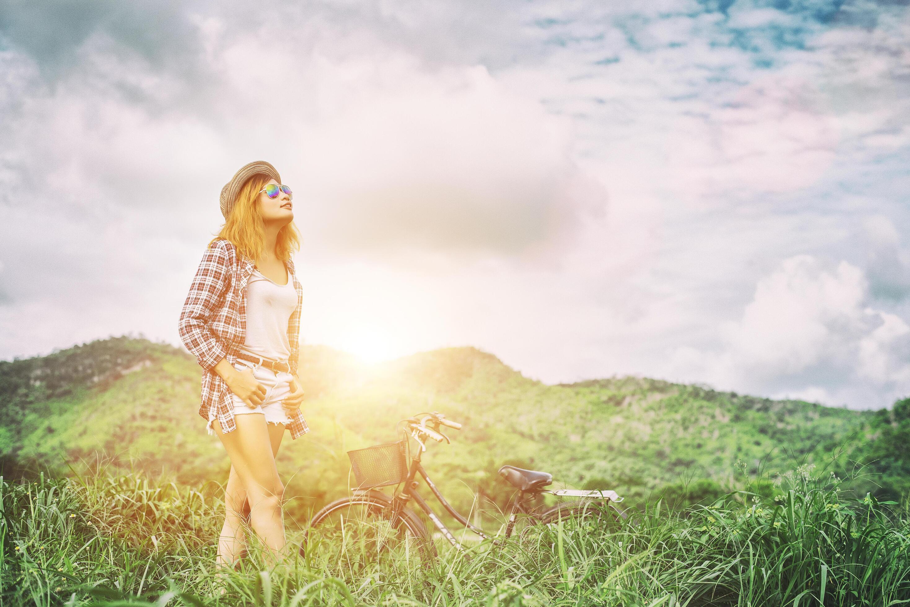 Young hipster woman enjoying fresh air in the mountain, freedom summer holiday, happy lifestyle. Stock Free