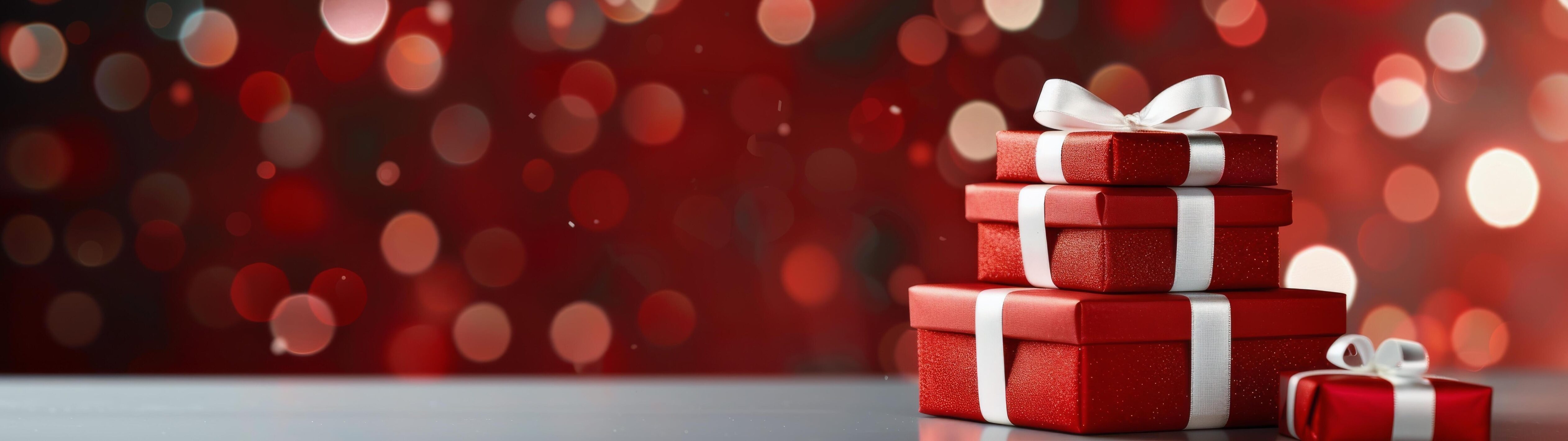 Festive Red Presents Wrapped With Silver Ribbon and Bokeh Background Stock Free