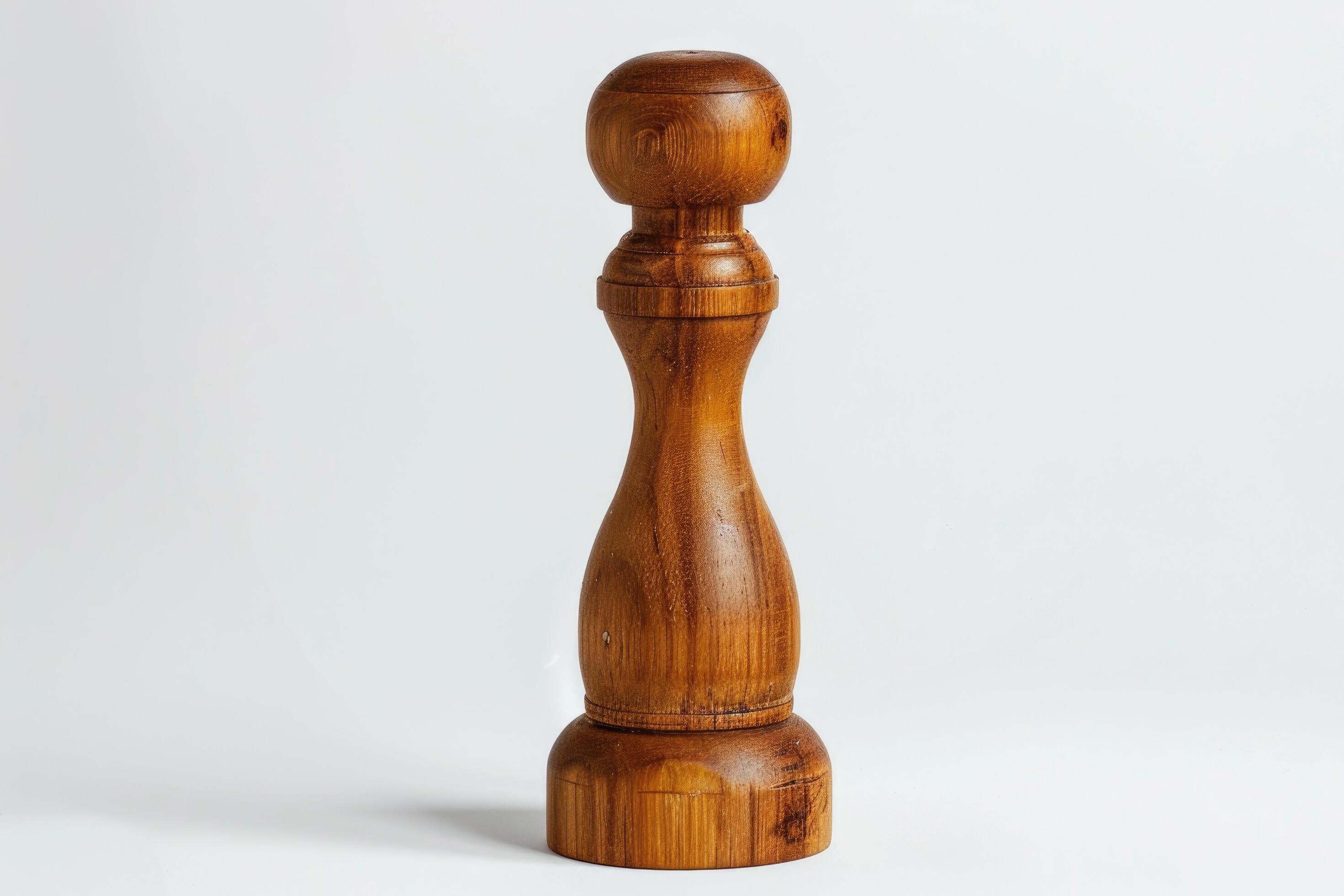 Wooden pepper mill on a white background. Stock Free