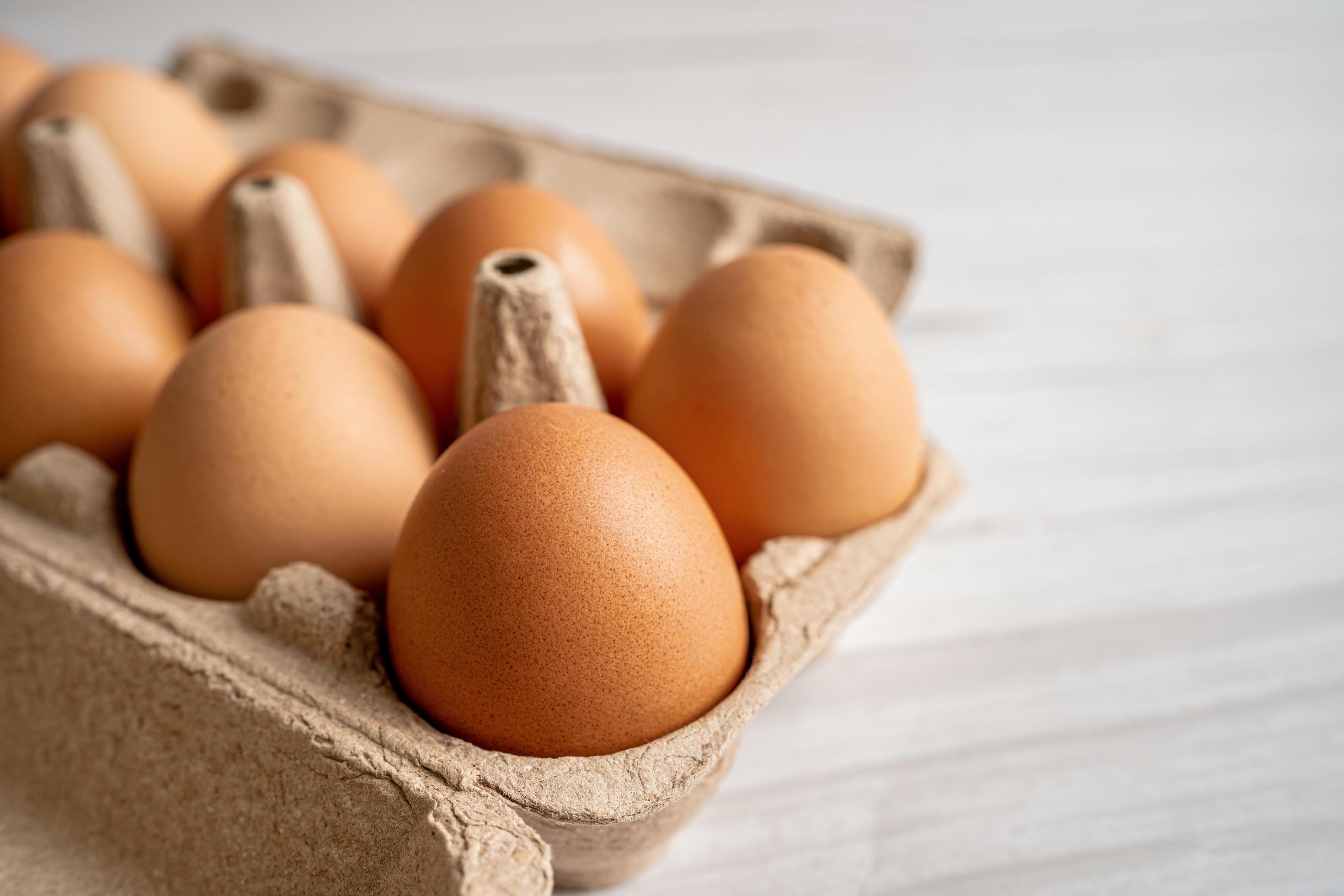 Organic fresh eggs in cardboard container pack with copy space, organic healthy food. Stock Free