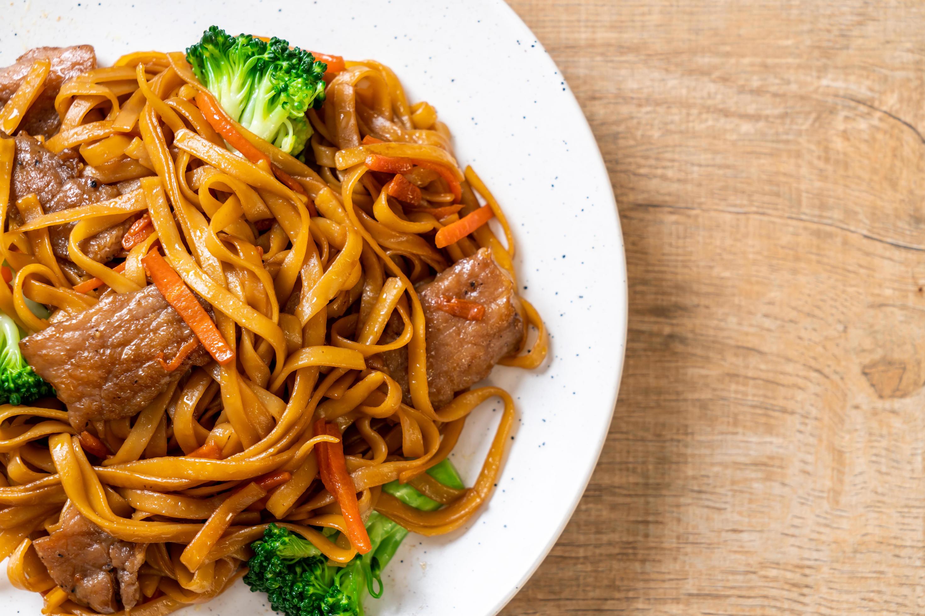 Stir-fried noodles with pork and vegetable – Asian food style Stock Free