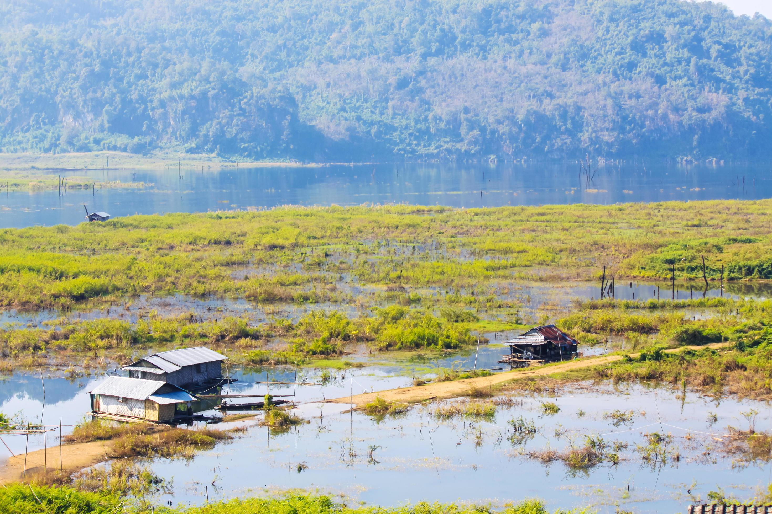 Houseboat in the Songgaria river and near mountain in Countryside of village at Snagklaburi, Thailand Stock Free