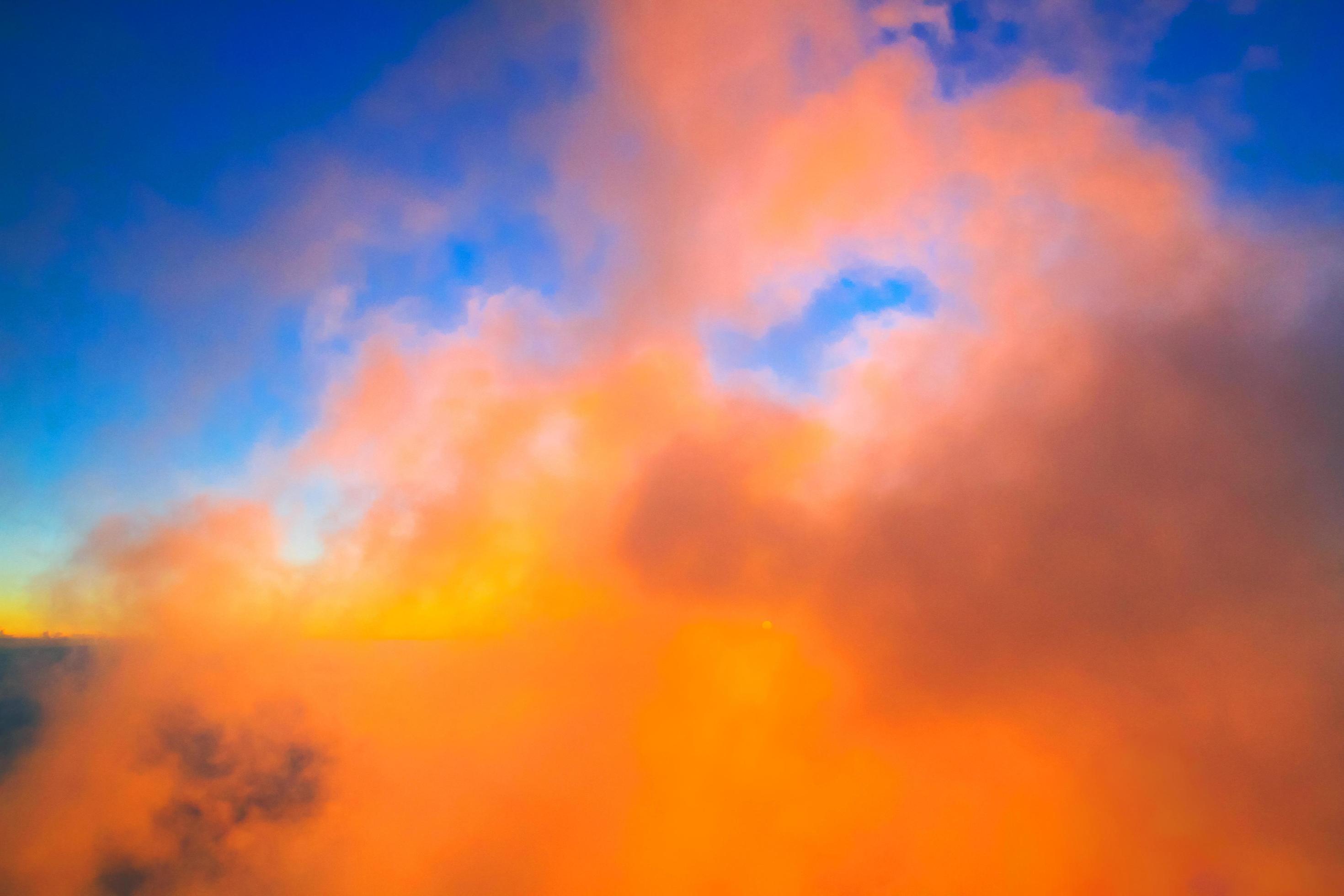 Sunset in sky and cloud, beautiful colorful twilight time with silhouette of mountain. Stock Free