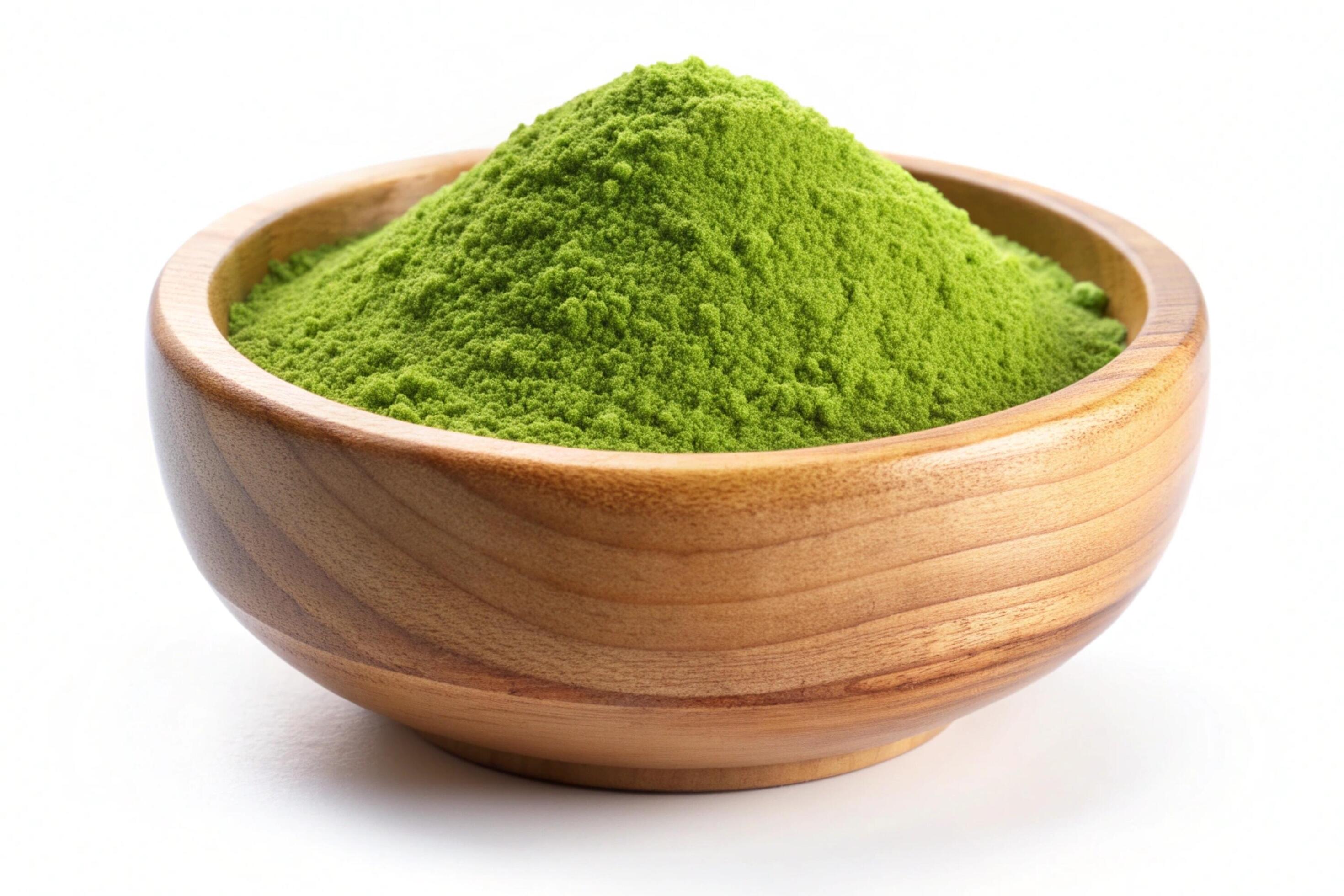 Instant green tea powder in wood bowl isolated on white background Stock Free