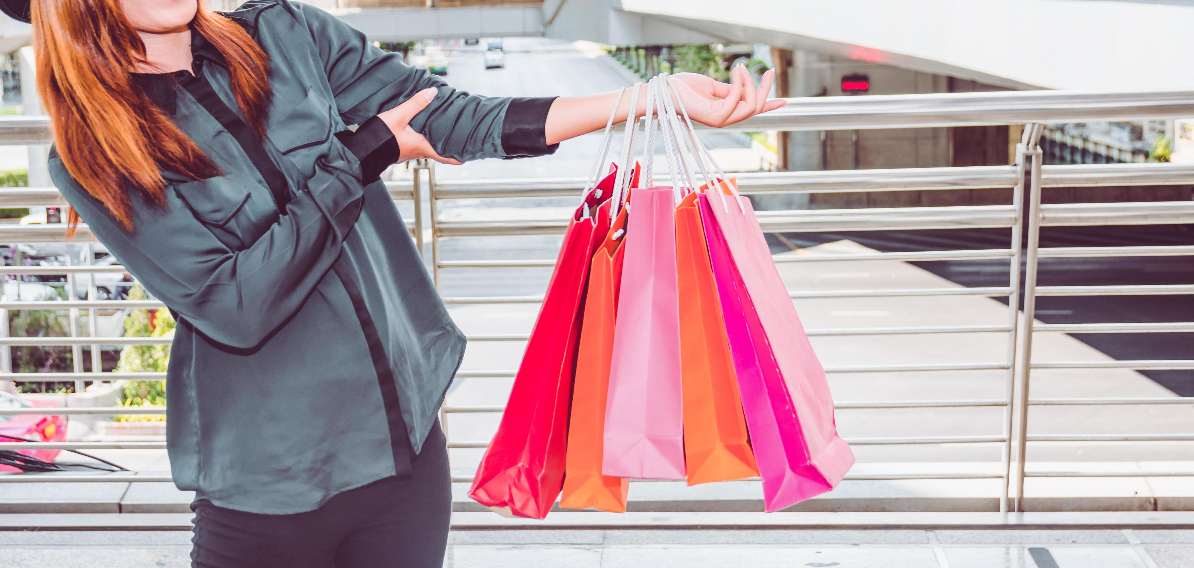 Happy woman with shopping bags enjoying in shopping. women shopping, lifestyle concept Stock Free