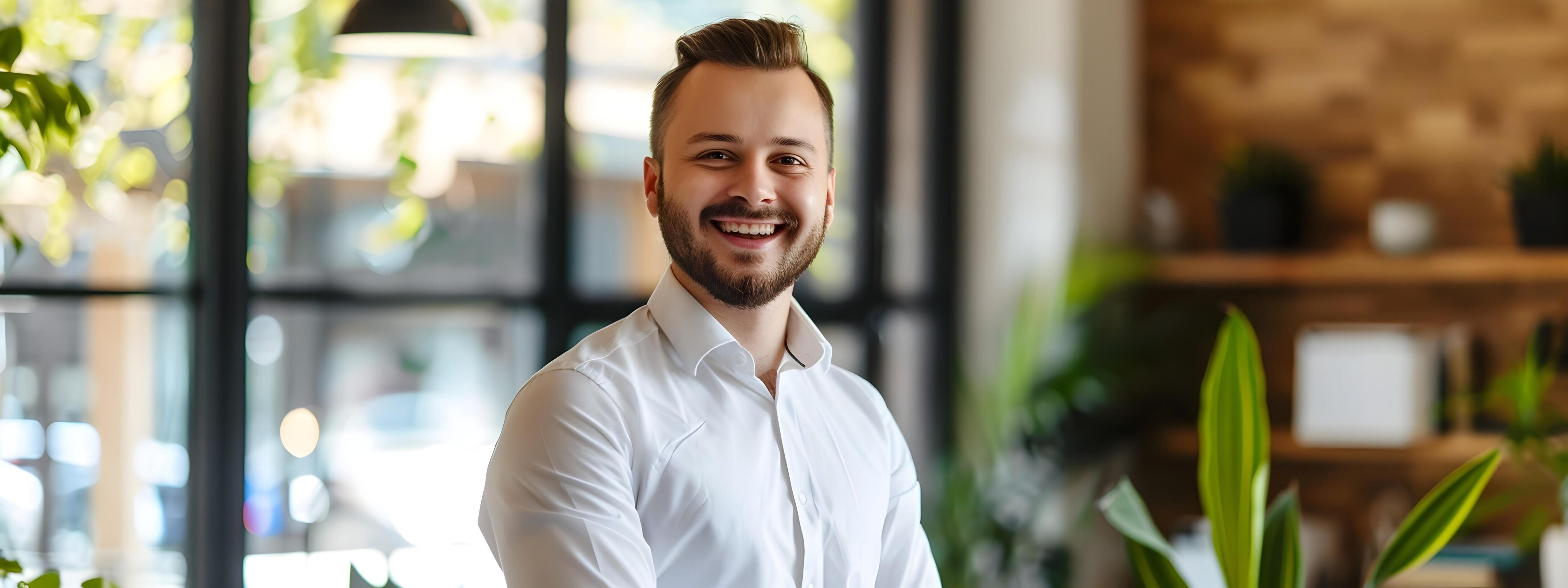 Cheerful Young Sales Manager Posing in Corporate Office Setting Stock Free