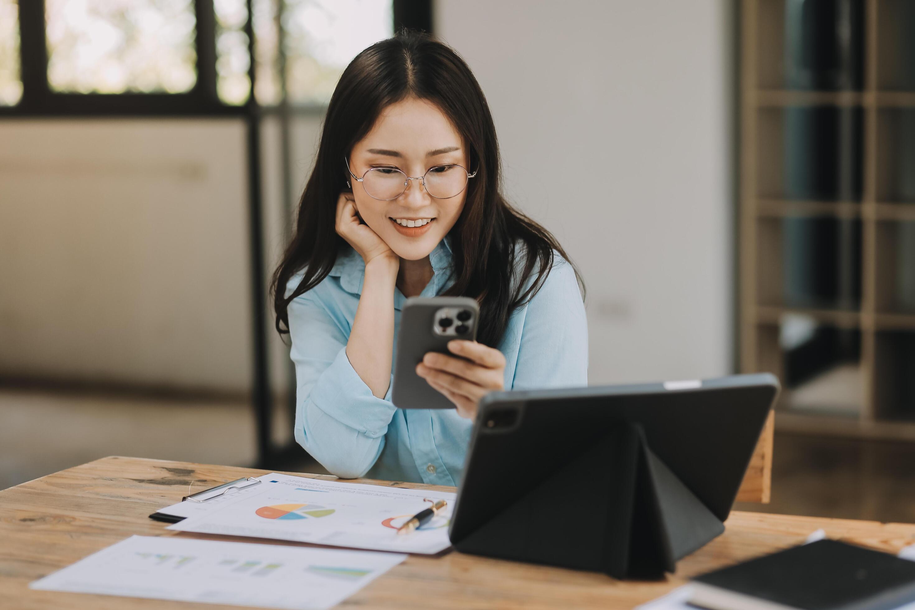 Asian woman working at the office. woman using laptop computer on desk at office Stock Free