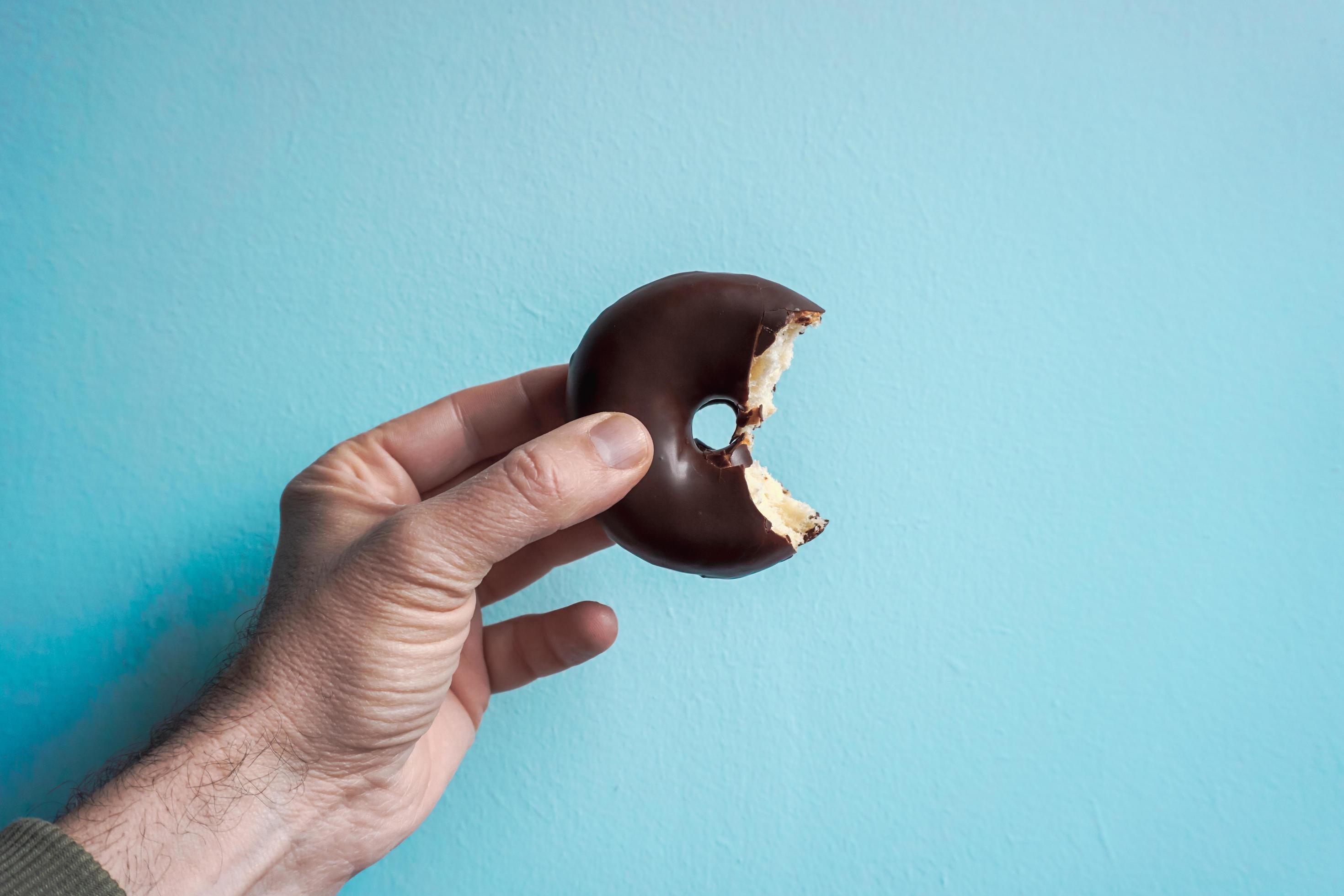 tasty chocolate donut for breakfast, unhealthy food Stock Free