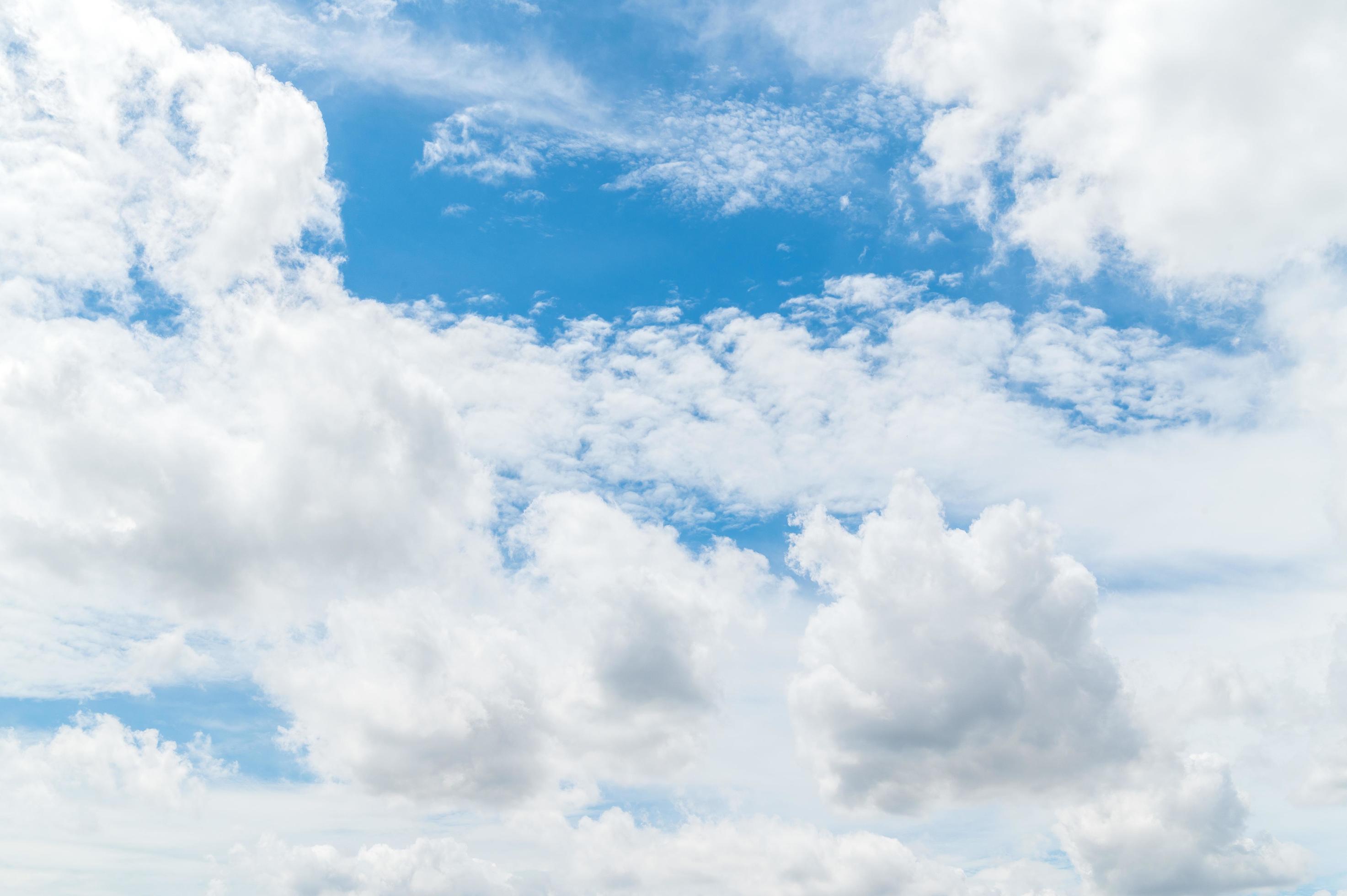 Beautiful white fluffy clouds in blue sky. Nature background from white clouds in sunny day Stock Free