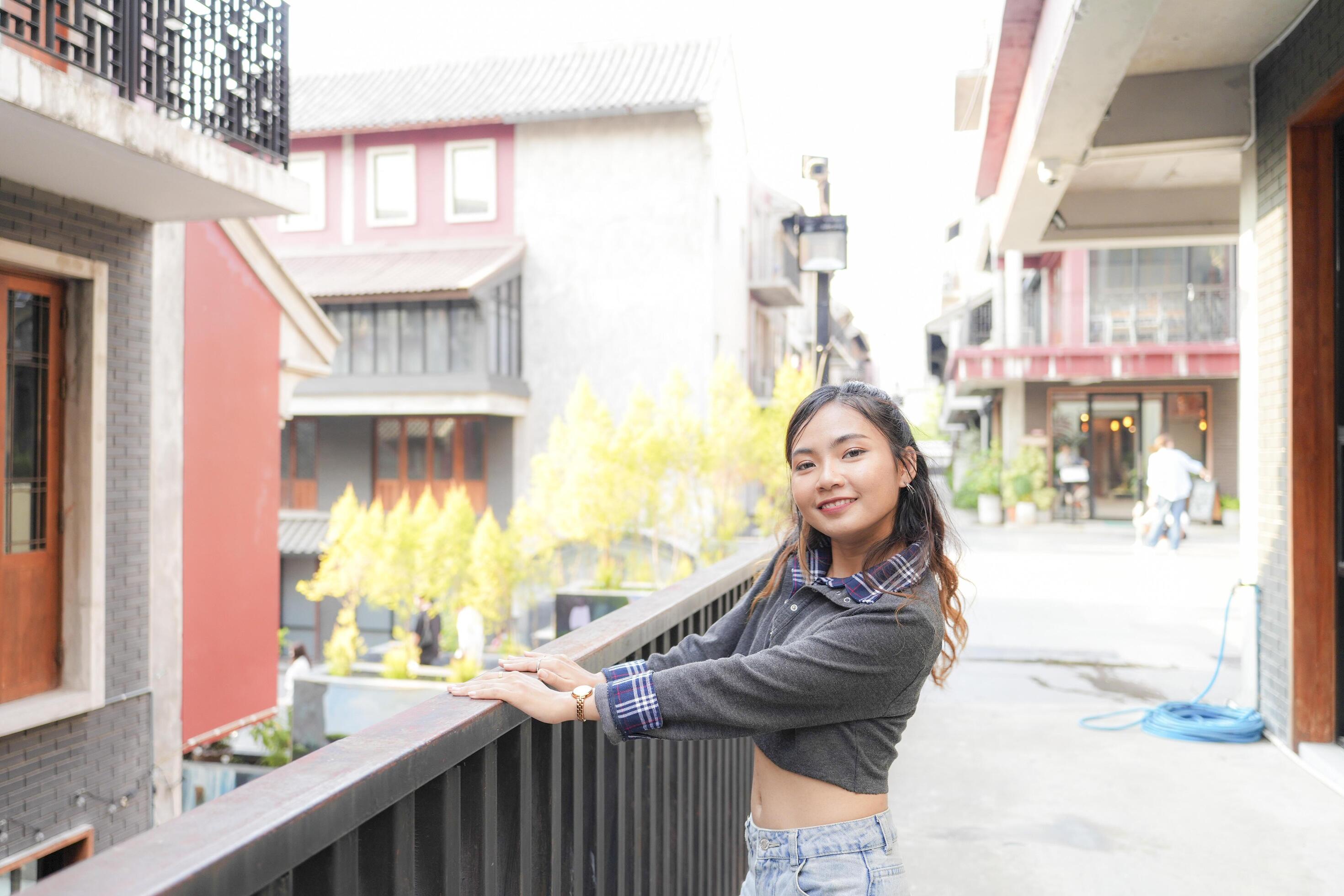 Asian women do freestyle hip hop and breakdancing in a public space in the middle of the city. With a cheerful and happy attitude Stock Free