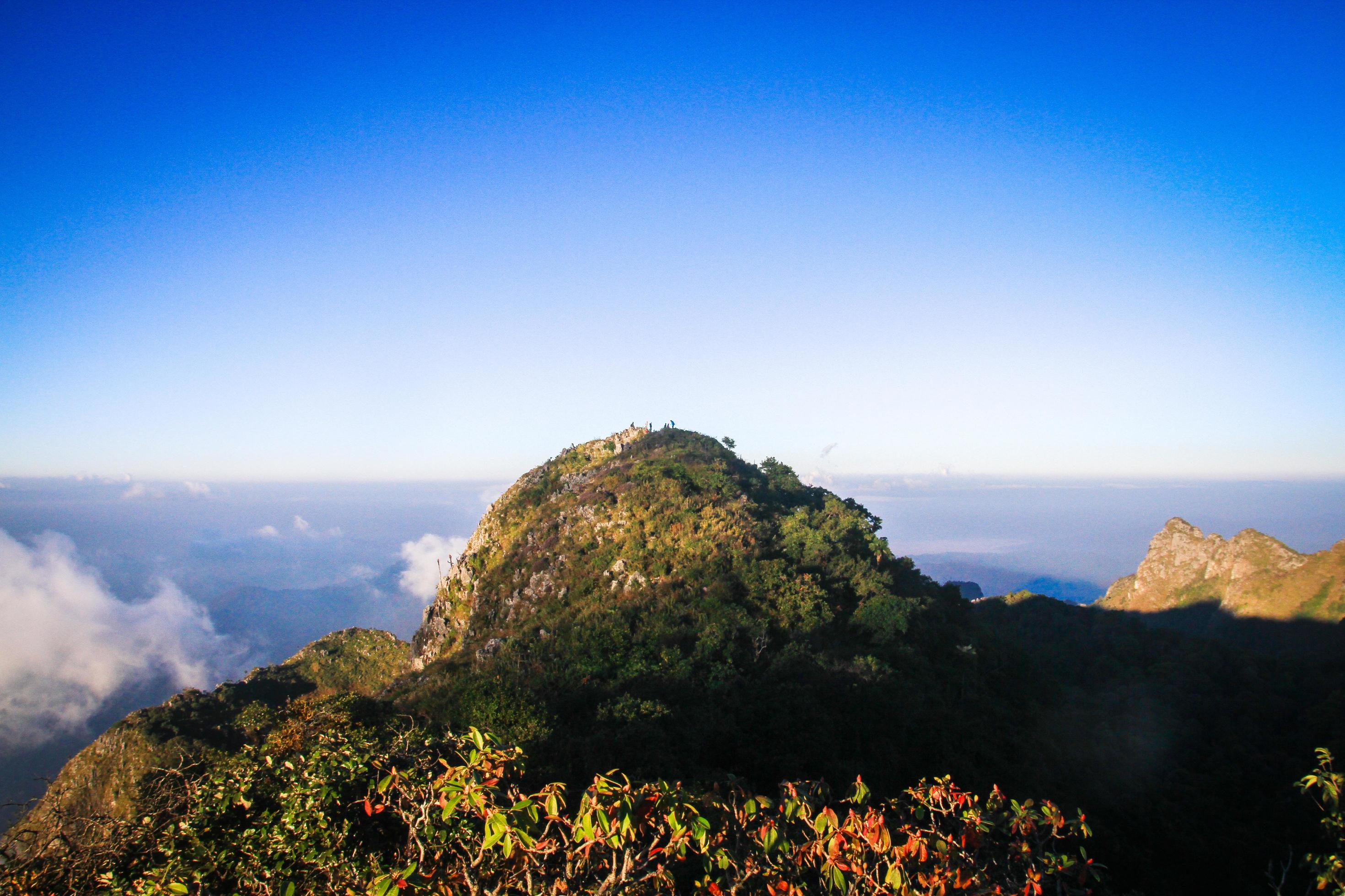 Sunrise in morning with sky and cloud on the Limestone mountain. Sunray with Fog and mist cover the jungle hill in Thailand Stock Free