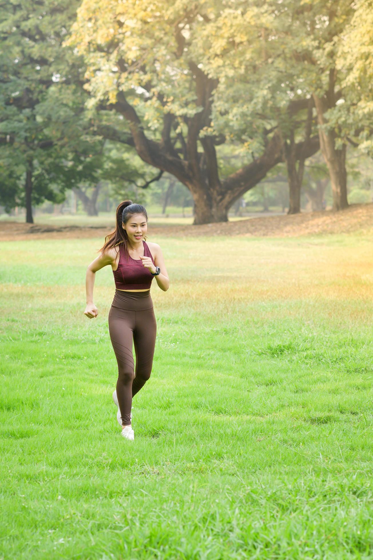 Beautiful Asian women exercise in the park every morning, It is a lifestyle for relaxation and good health of the body Stock Free