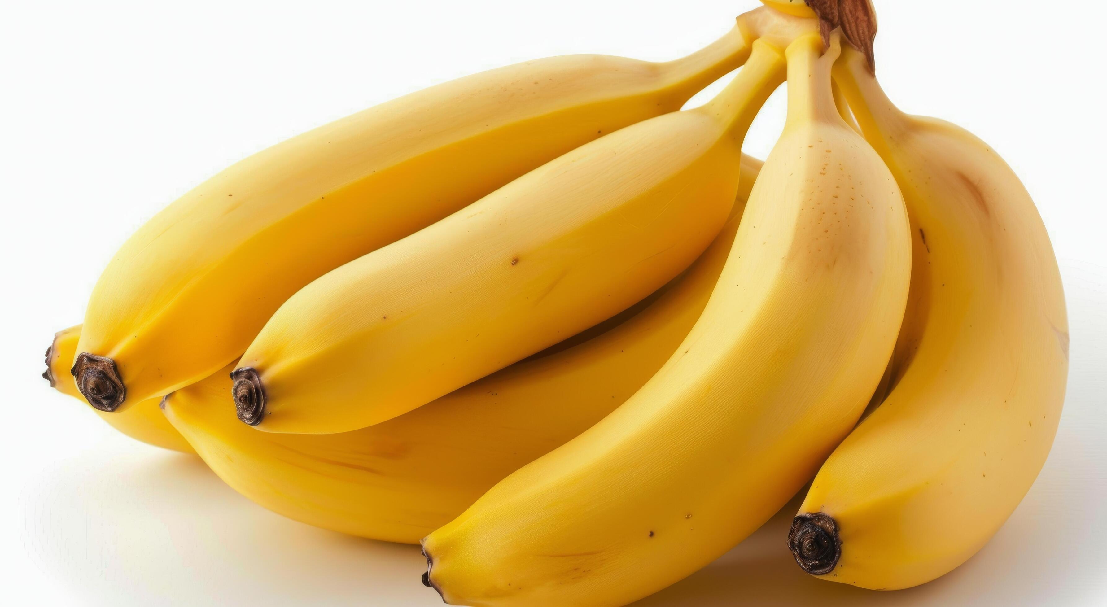 Yellow Bananas Stacked With Sliced Fruit Isolated on White Background Stock Free