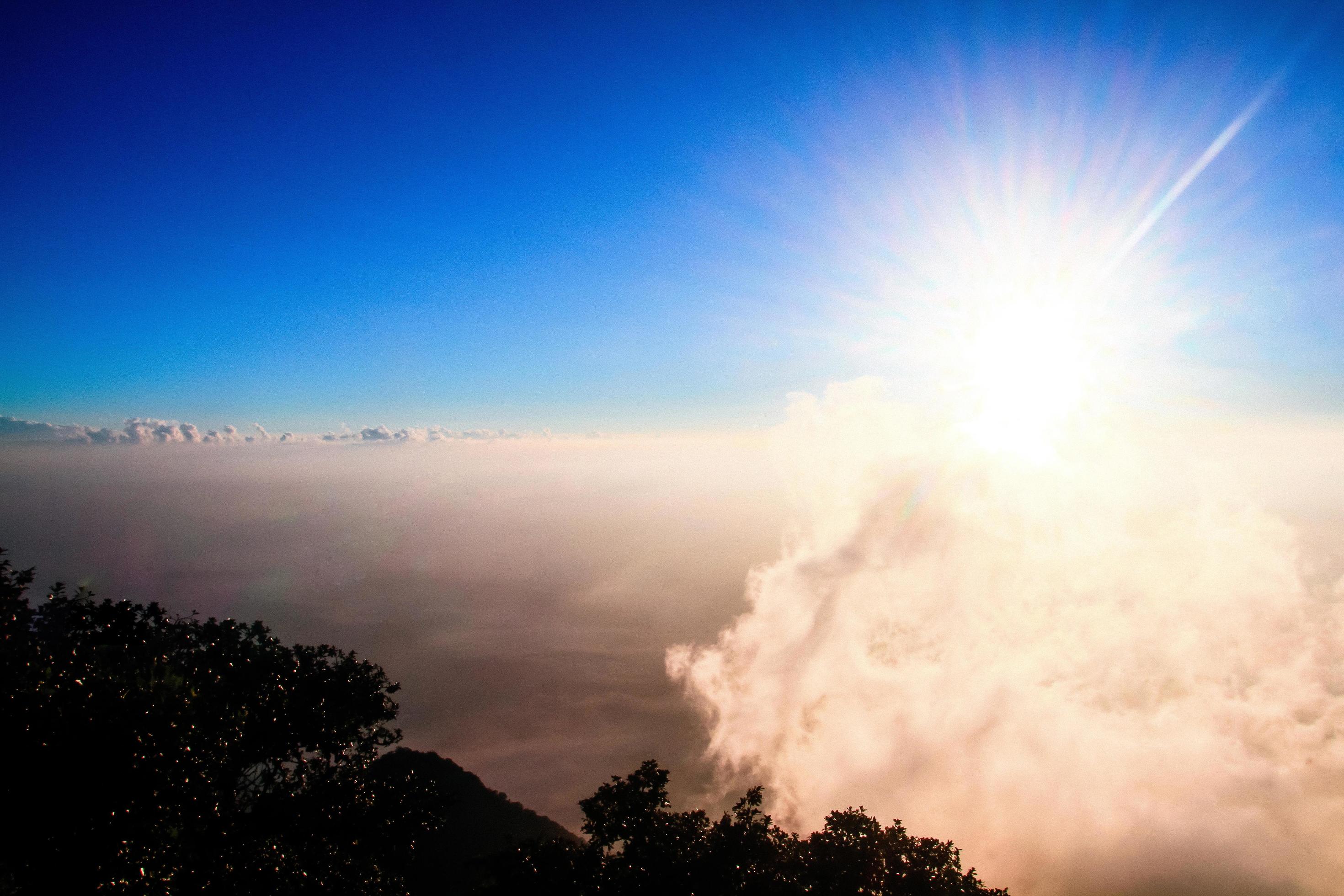 Golden light with sunrise in morning on the sky and cloud on the mountain. Fog cover the jungle hill in Thailand Stock Free