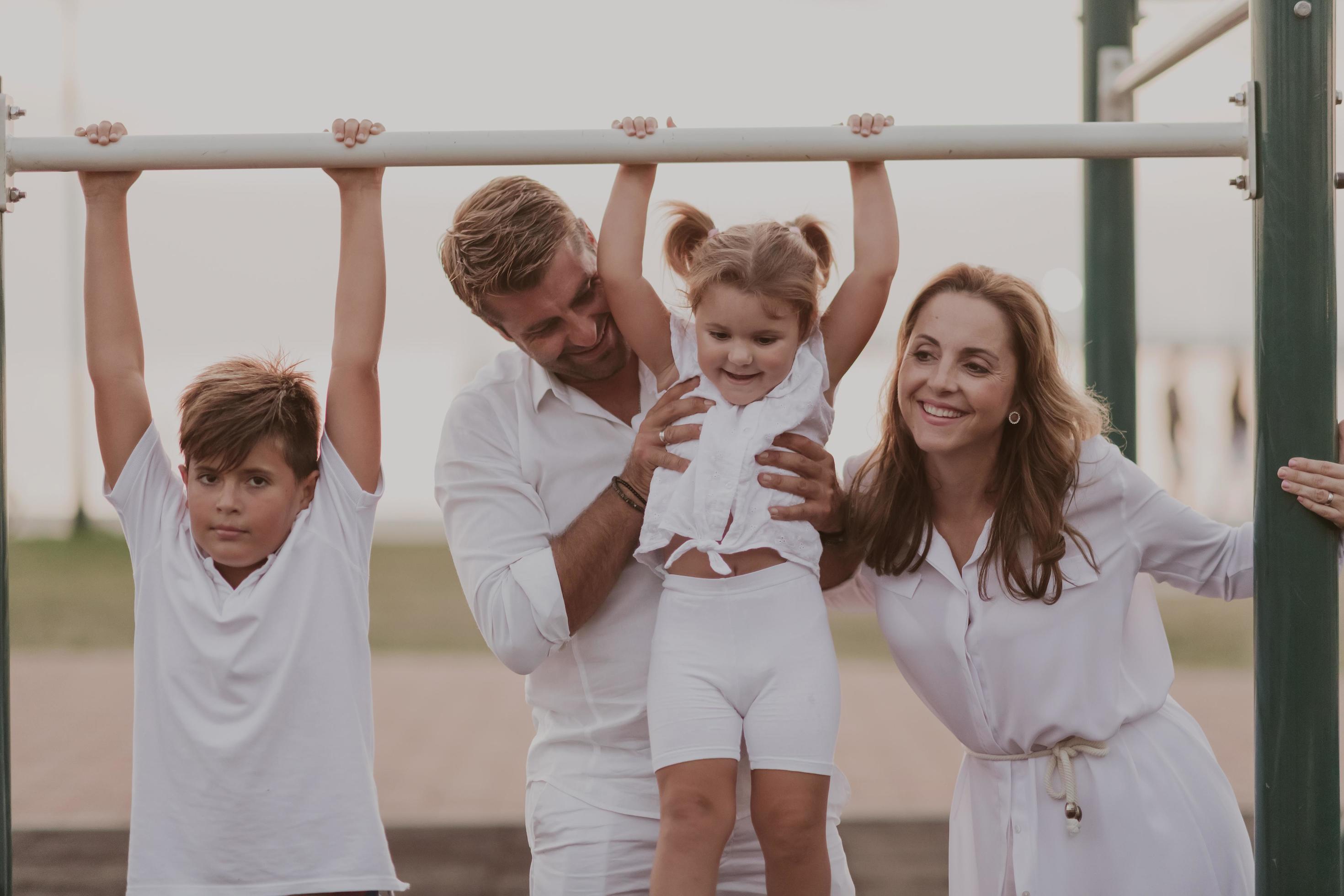 Senior couple in casual clothes with their children spending time in park a vacation together. Family time . Selective focus Stock Free