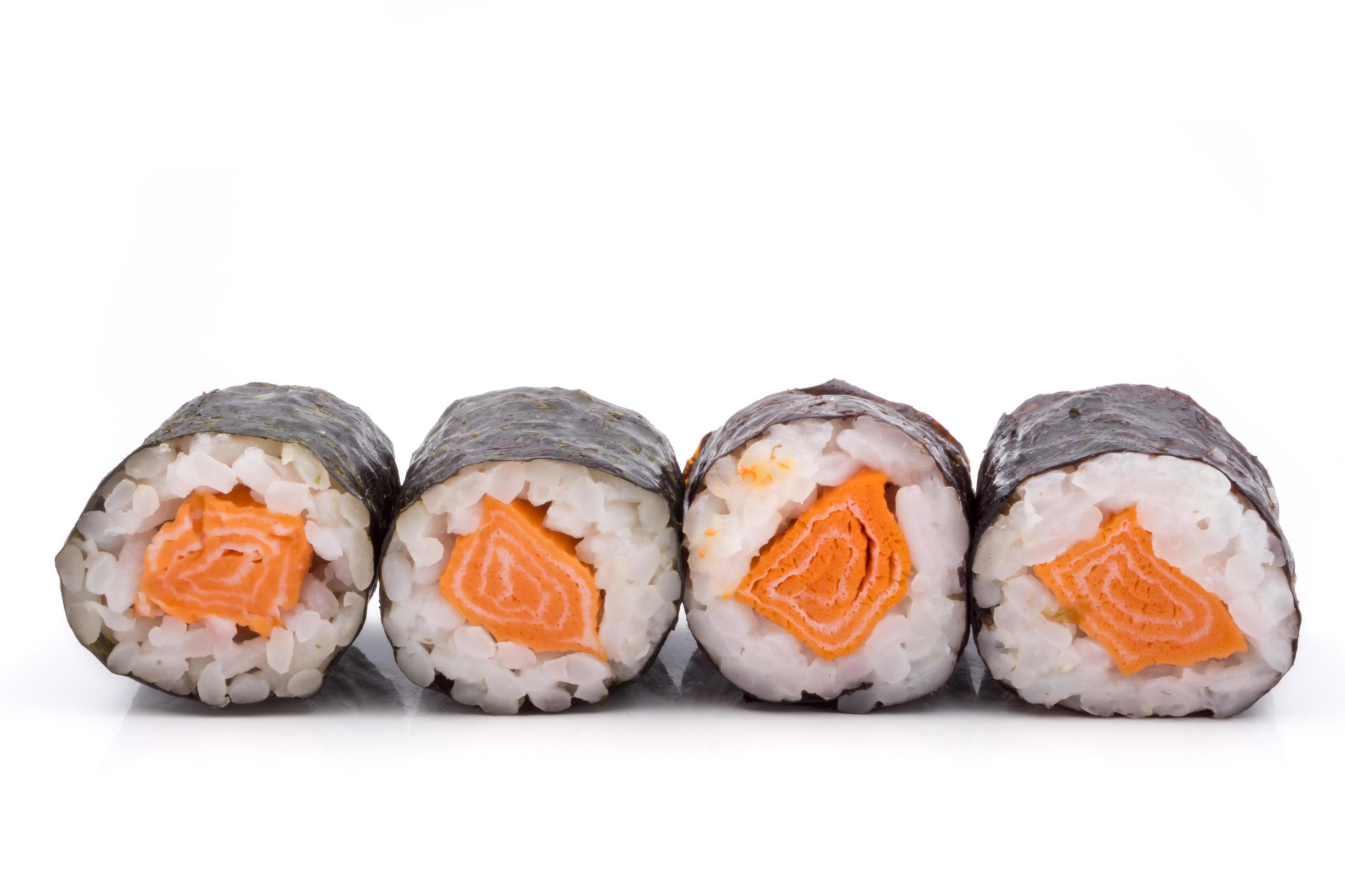 Sushi rolls, rice with salmon and seaweed on white background, japanese food. Stock Free