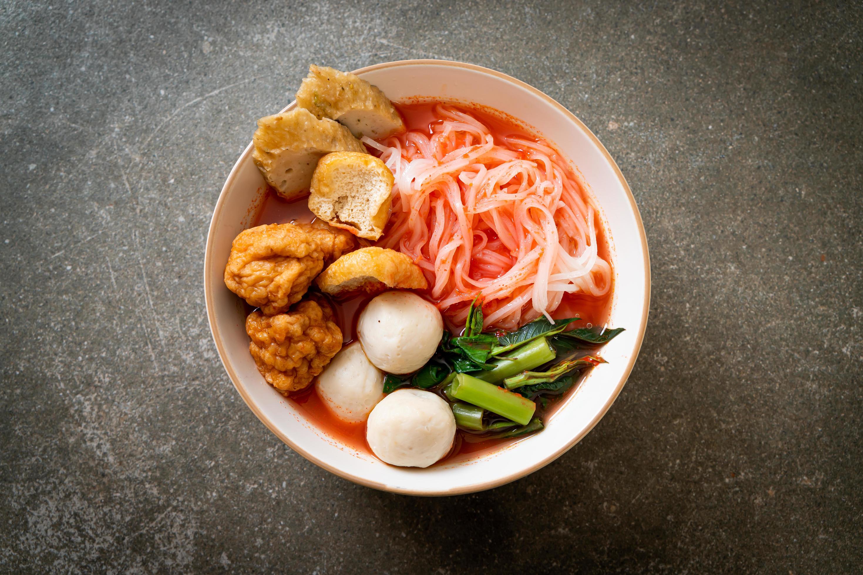 Small flat rice noodles with fish balls and shrimp balls in pink soup, Yen Ta Four or Yen Ta Fo – Asian food style Stock Free