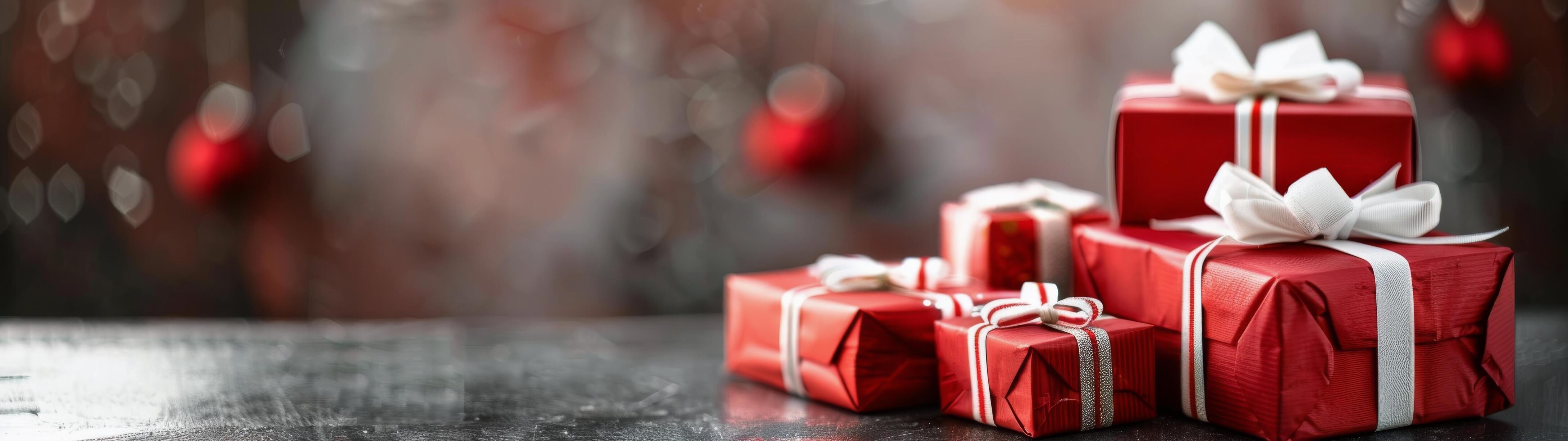 Festive Red Presents Wrapped With Silver Ribbon and Bokeh Background Stock Free