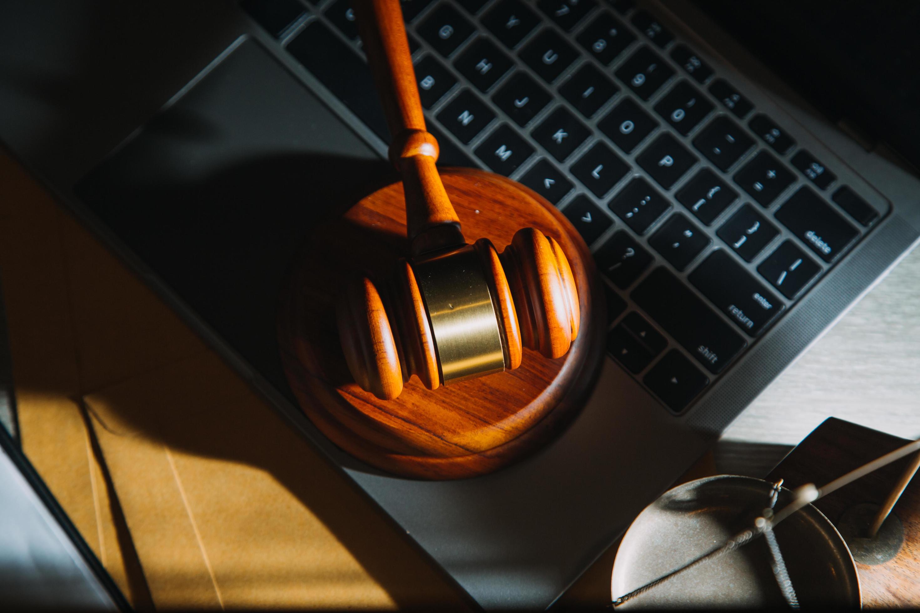 Business and lawyers discussing contract papers with brass scale on desk in office. Law, legal services, advice, justice and law concept Stock Free