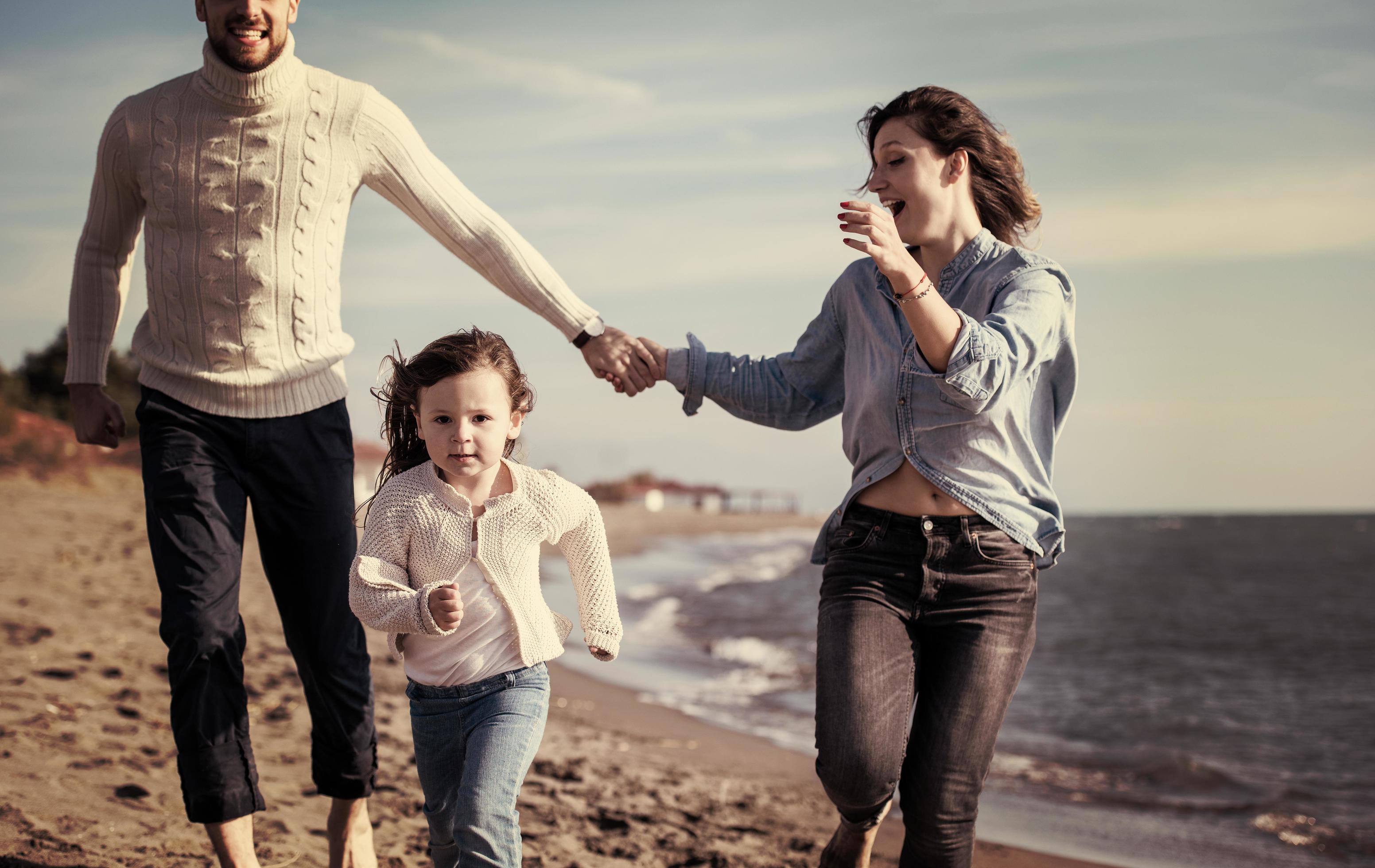 Young family enjoying vecation during autumn Stock Free