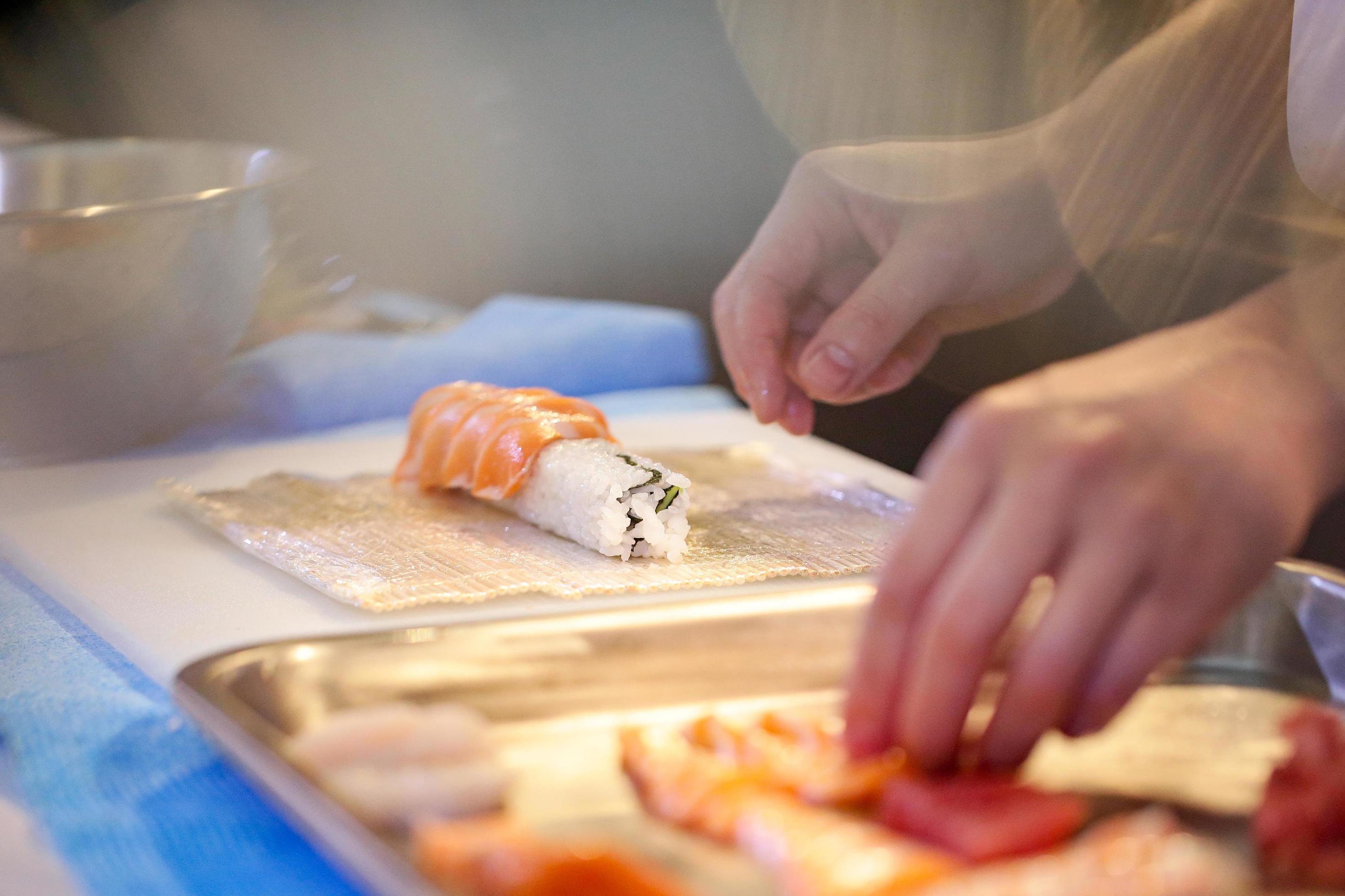 chef hands preparing japanese food, chef making sushi Stock Free