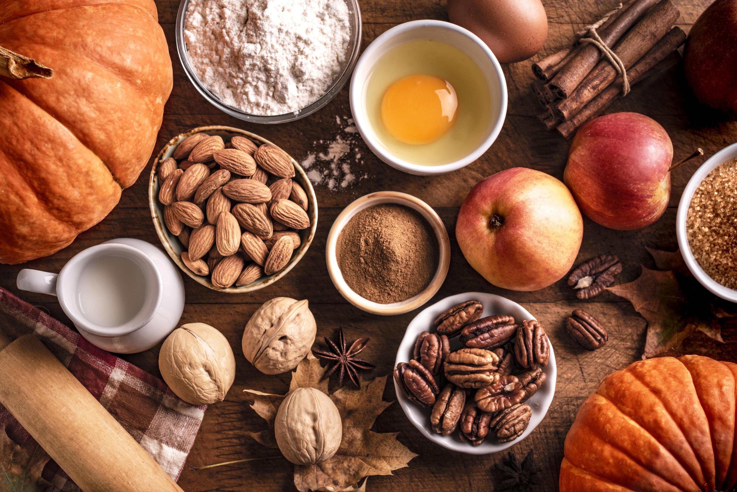 Autumn baking background with pumpkins, apples and nuts Stock Free