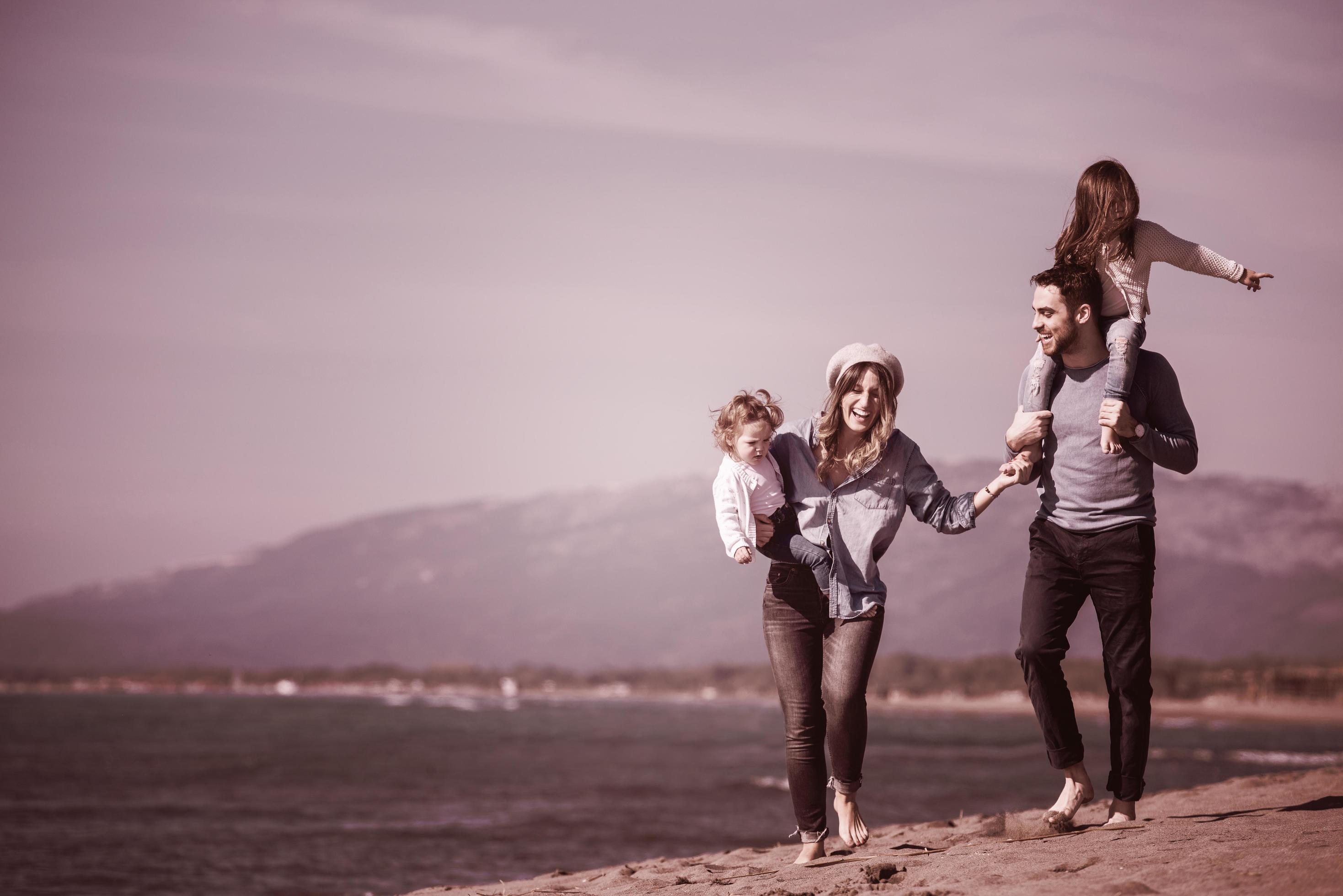 Young family enjoying vecation during autumn Stock Free