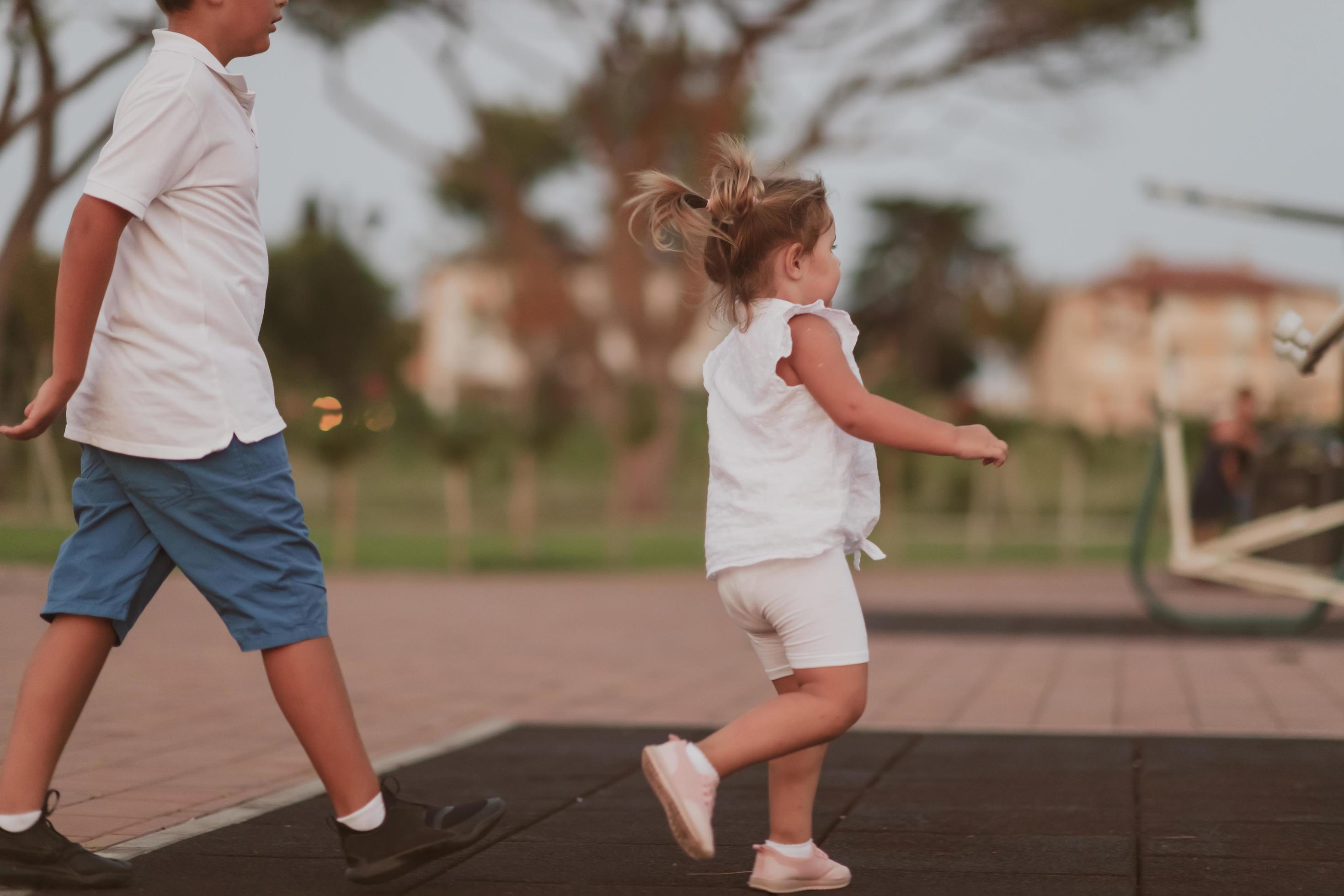 An elderly man in casual clothes with his daughter spends time together in the park on vacation. Family time. Selective focus Stock Free