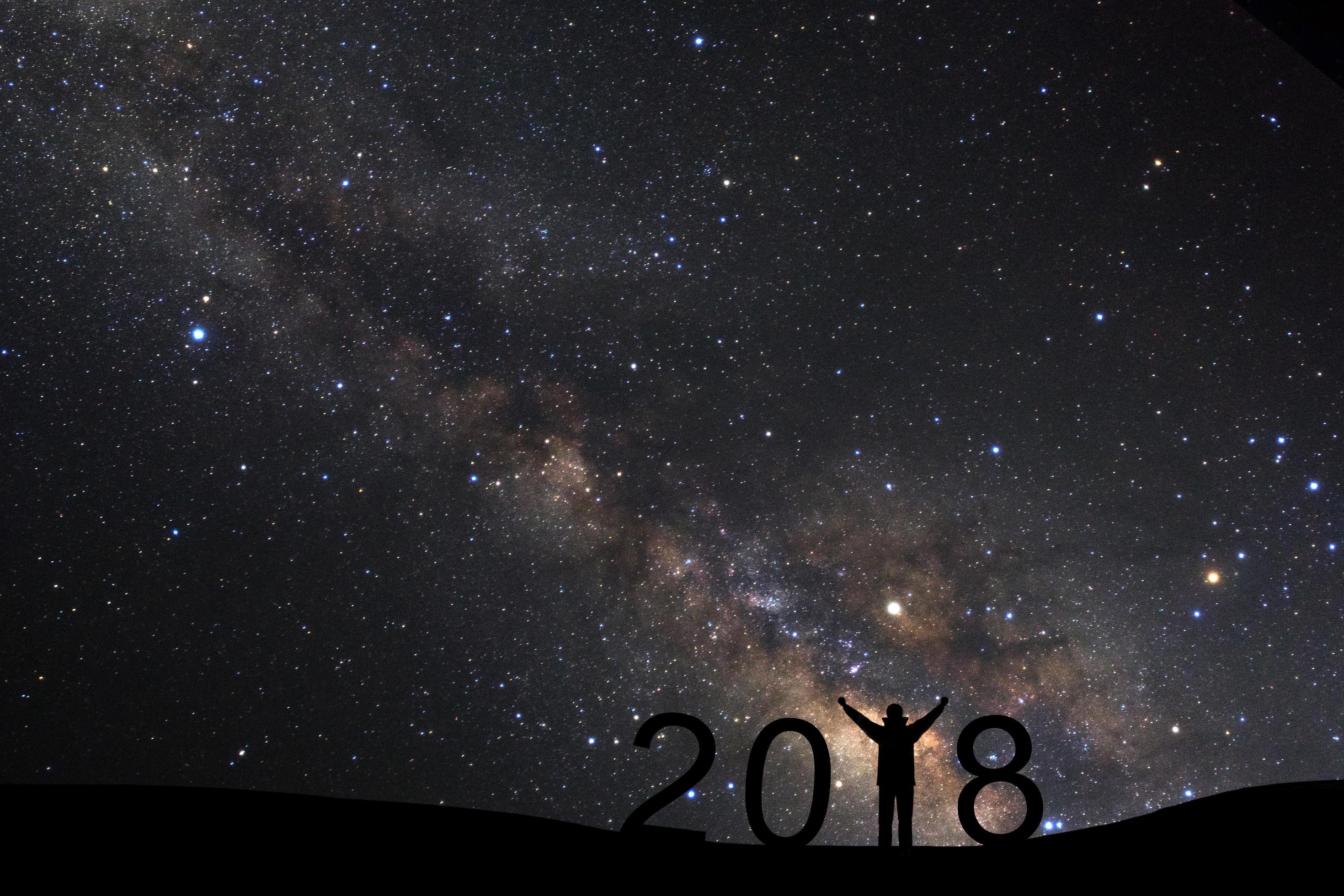 silhouette of a standing sporty man for Happy New Year 2018 background on with milky way, Night sky with stars Stock Free