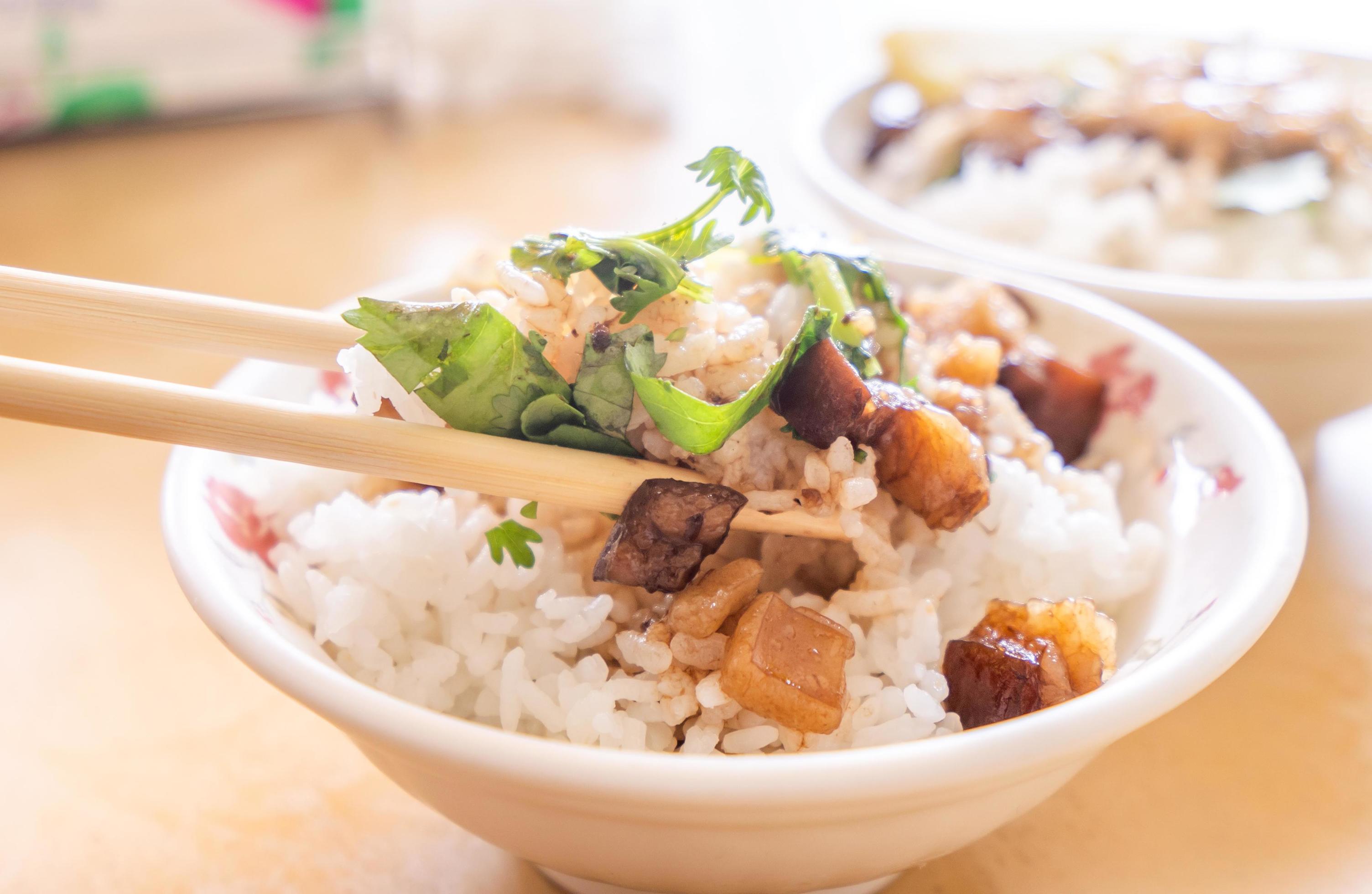 Braised pork over rice – Taiwan famous traditional street food delicacy. Soy-stewed pork on rice. Travel design concept. Top view,copy space,close up Stock Free