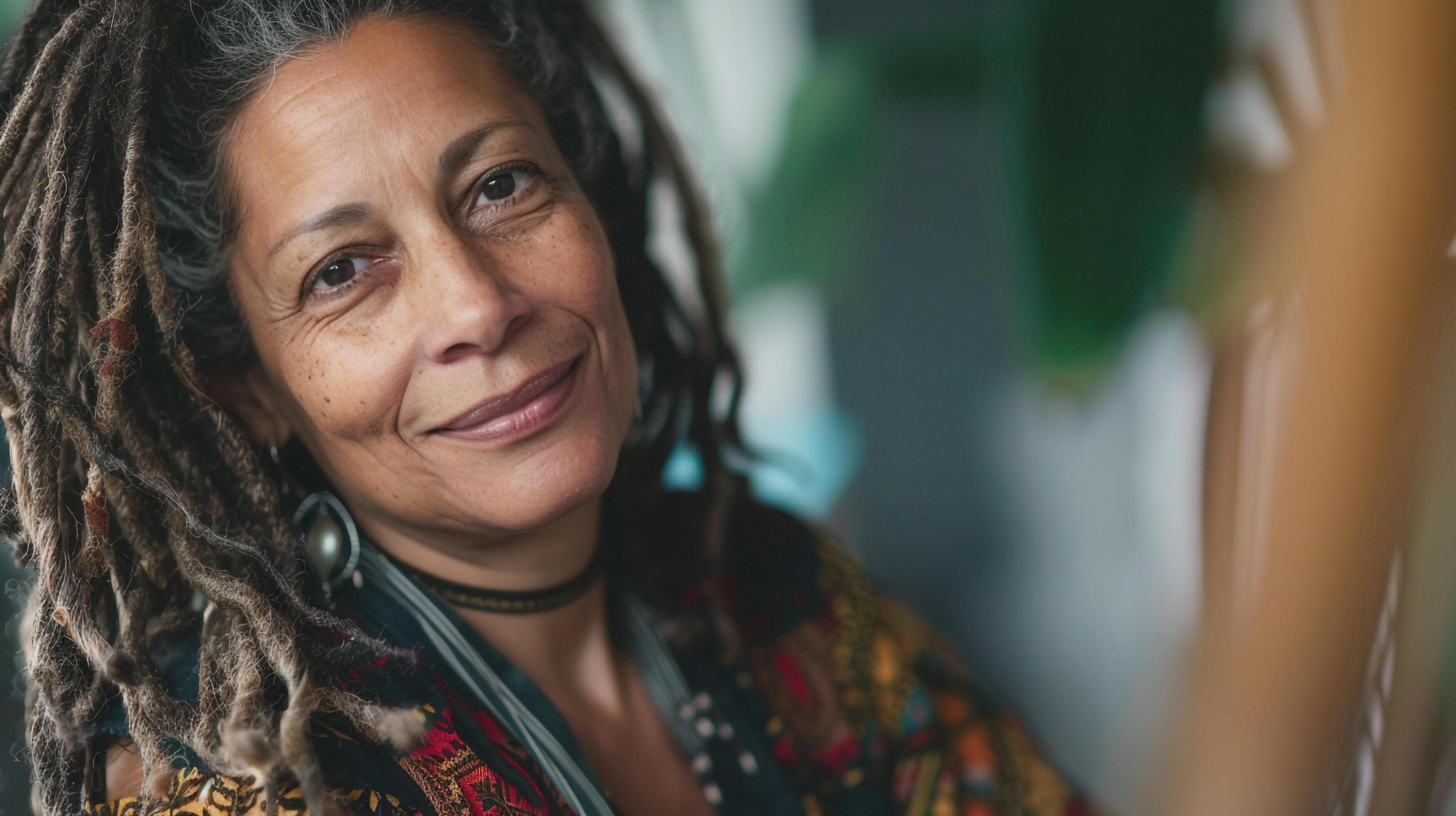 Close-up woman with dreadlocks smiling Stock Free