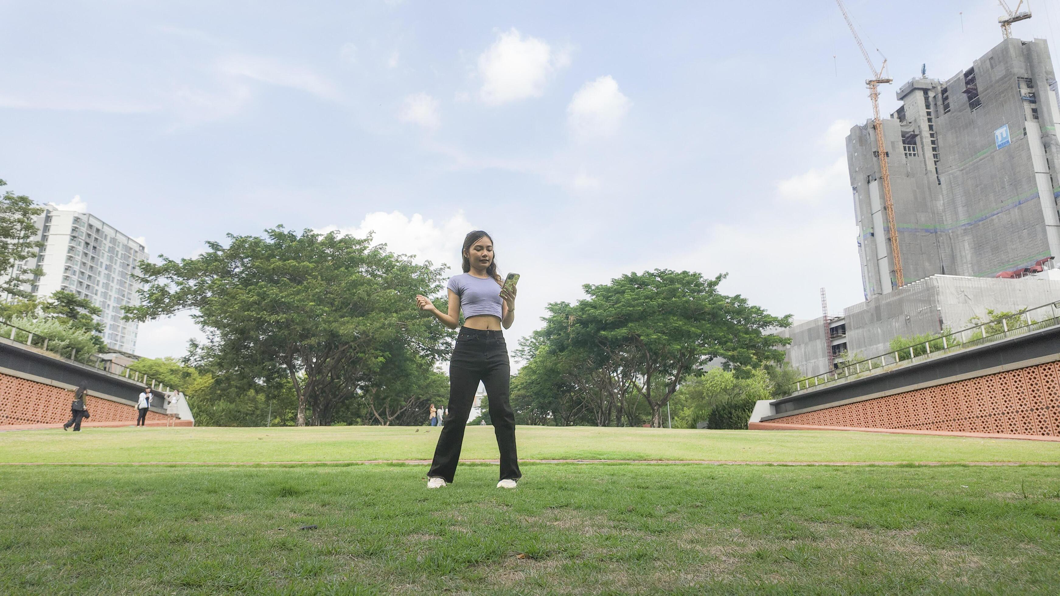 Asian women do freestyle hip hop and breakdancing in a public space in the middle of the city. With a cheerful and happy attitude Stock Free