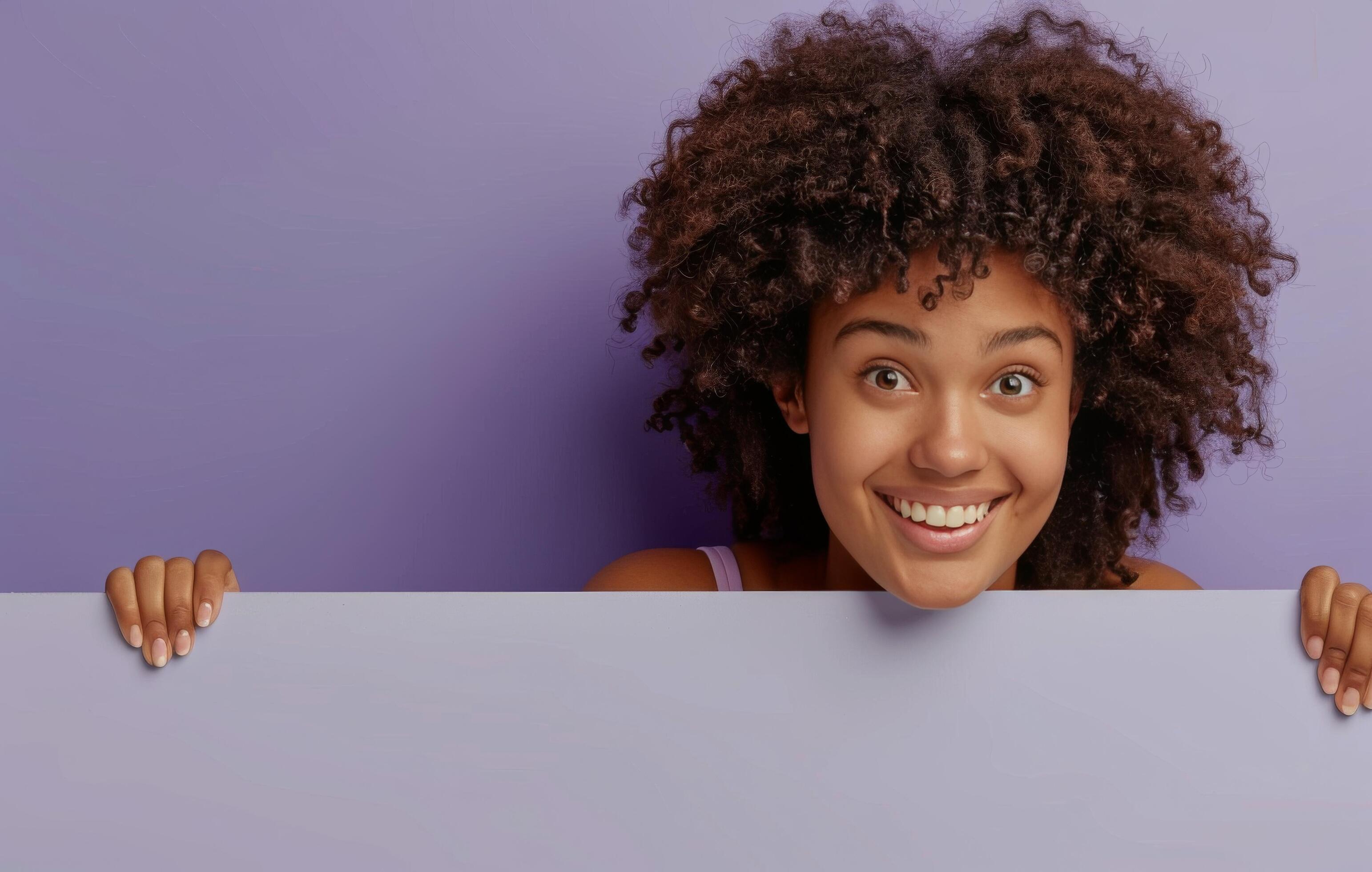 Smiling Woman Peeking Over Light Purple Background Stock Free