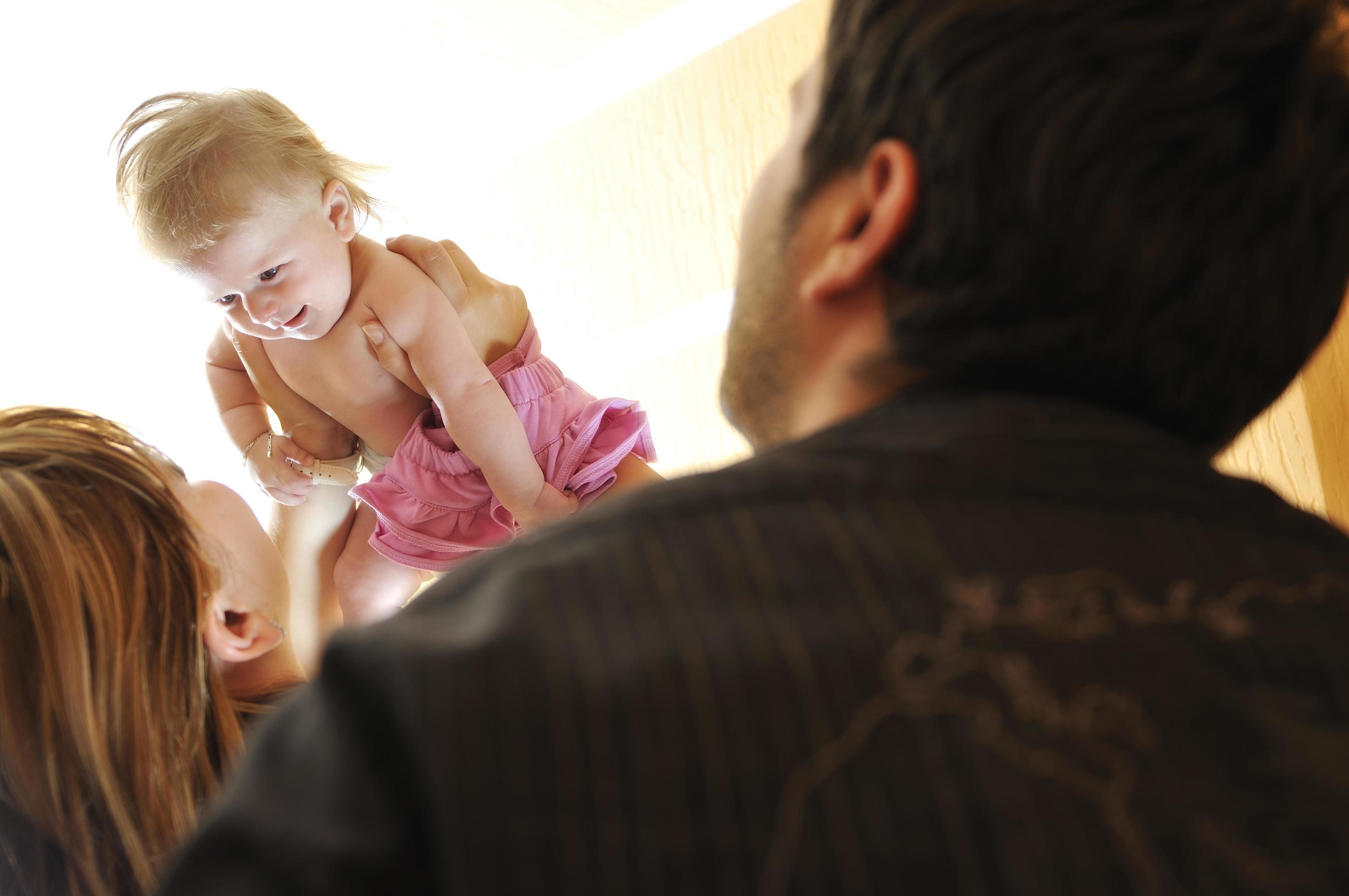 
									portrait of young family with cute little babby Stock Free